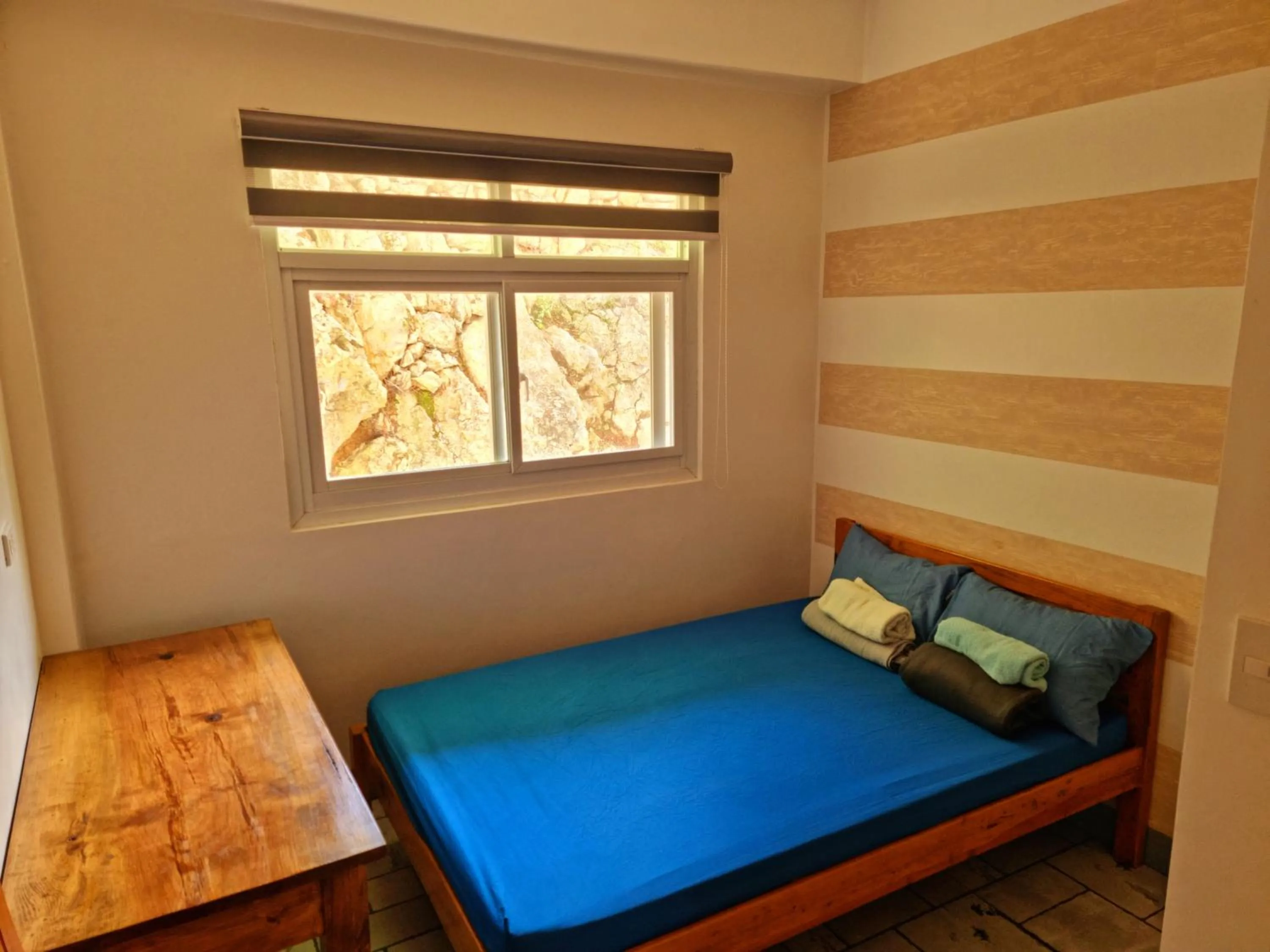 Bed in Wanay's Rocky Mountain Homestay