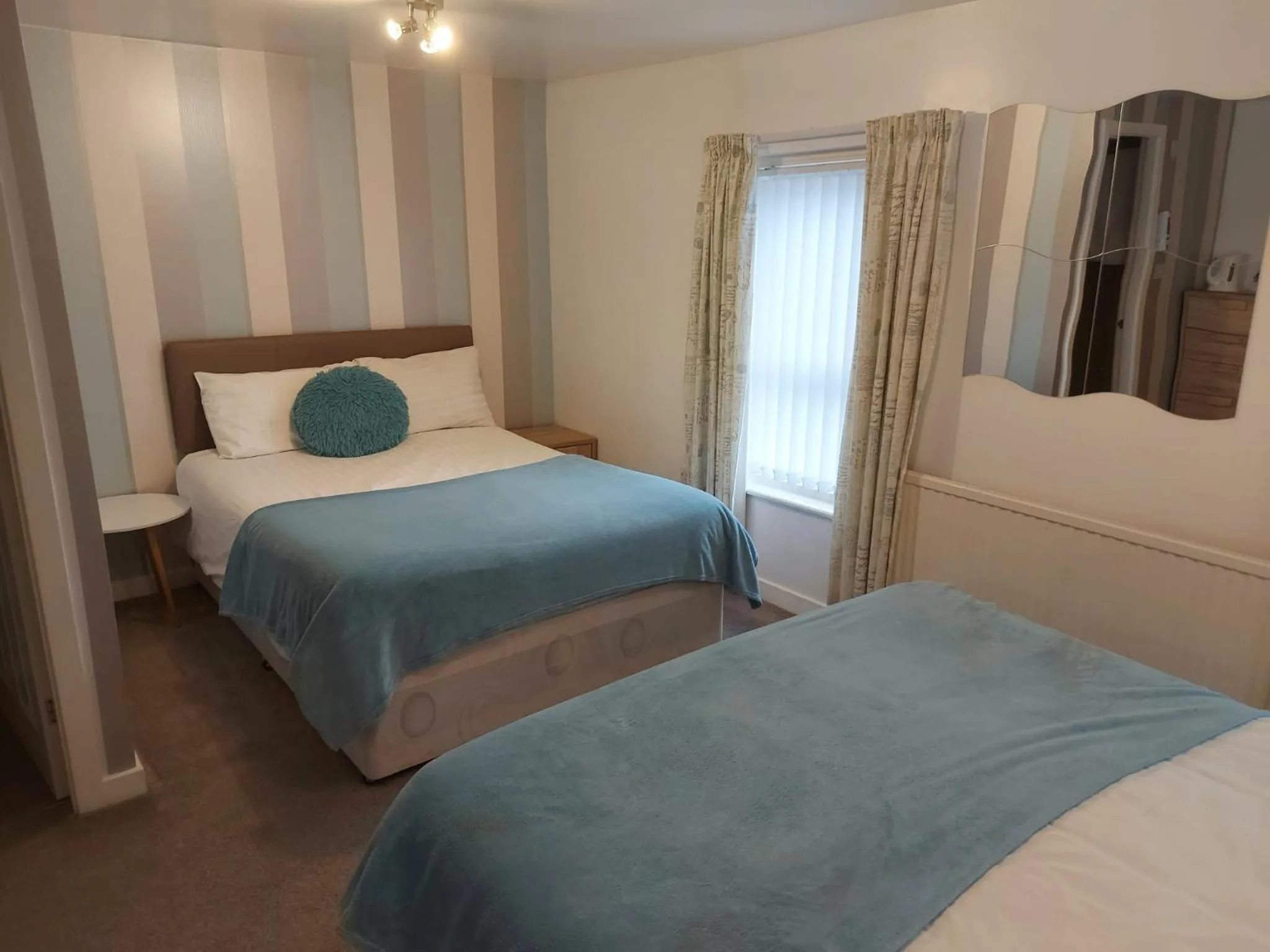 Bed in Four Seasons Guest House
