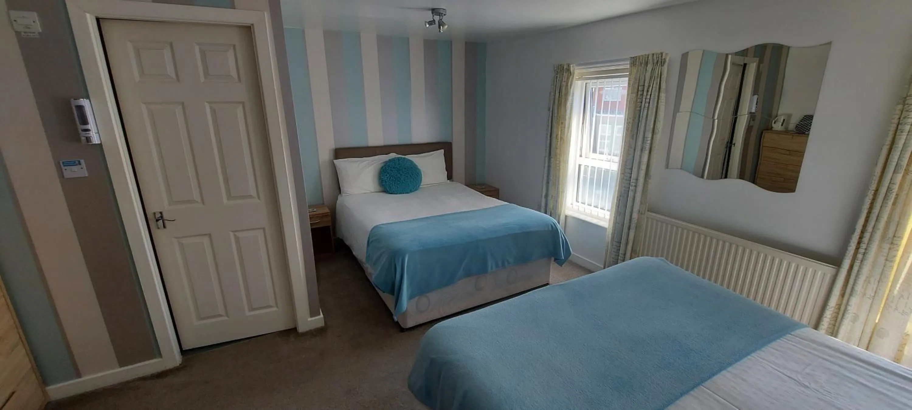 Bed in Four Seasons Guest House