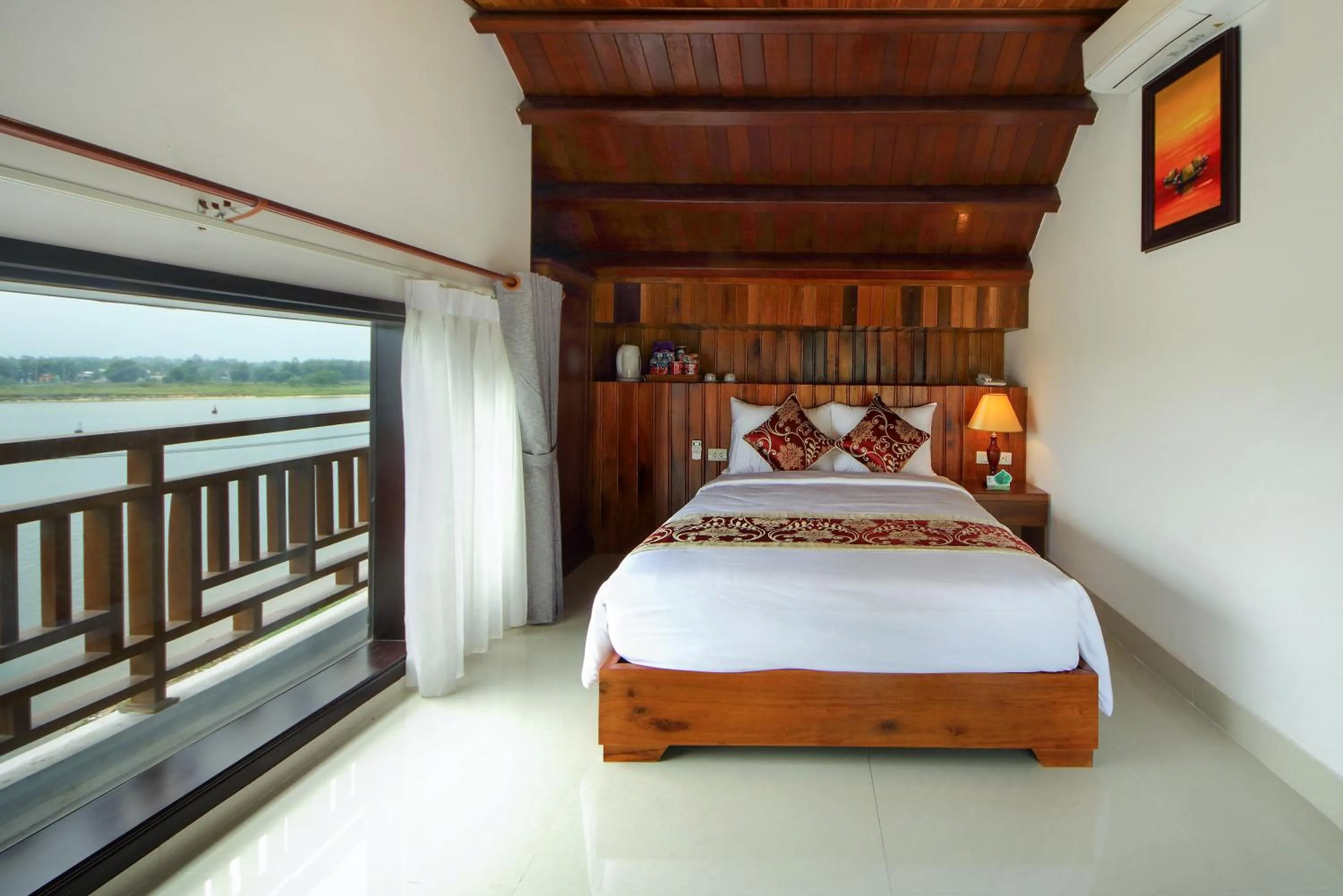Bed in Threeway Riverside Villa