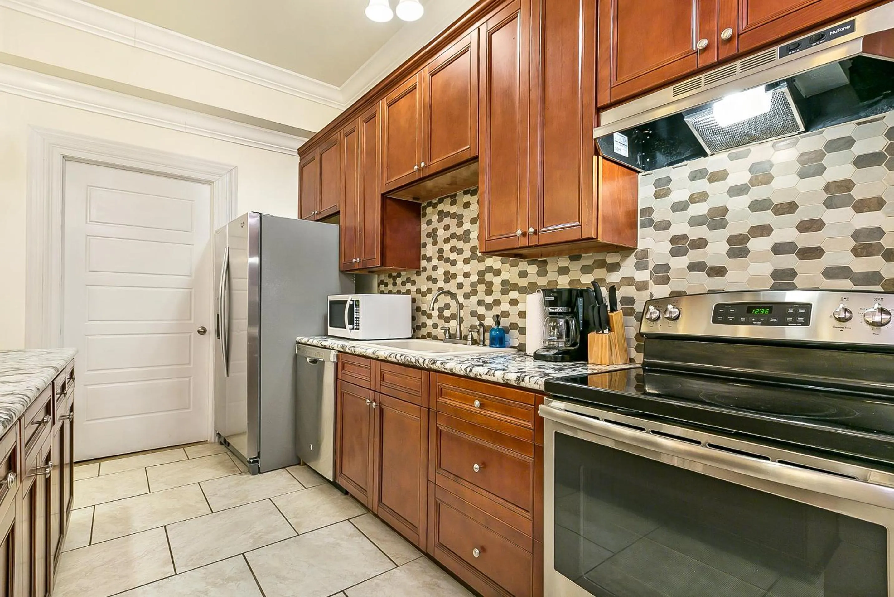 Kitchen or kitchenette in Spacious 4BR City Condo steps from St Charles Ave
