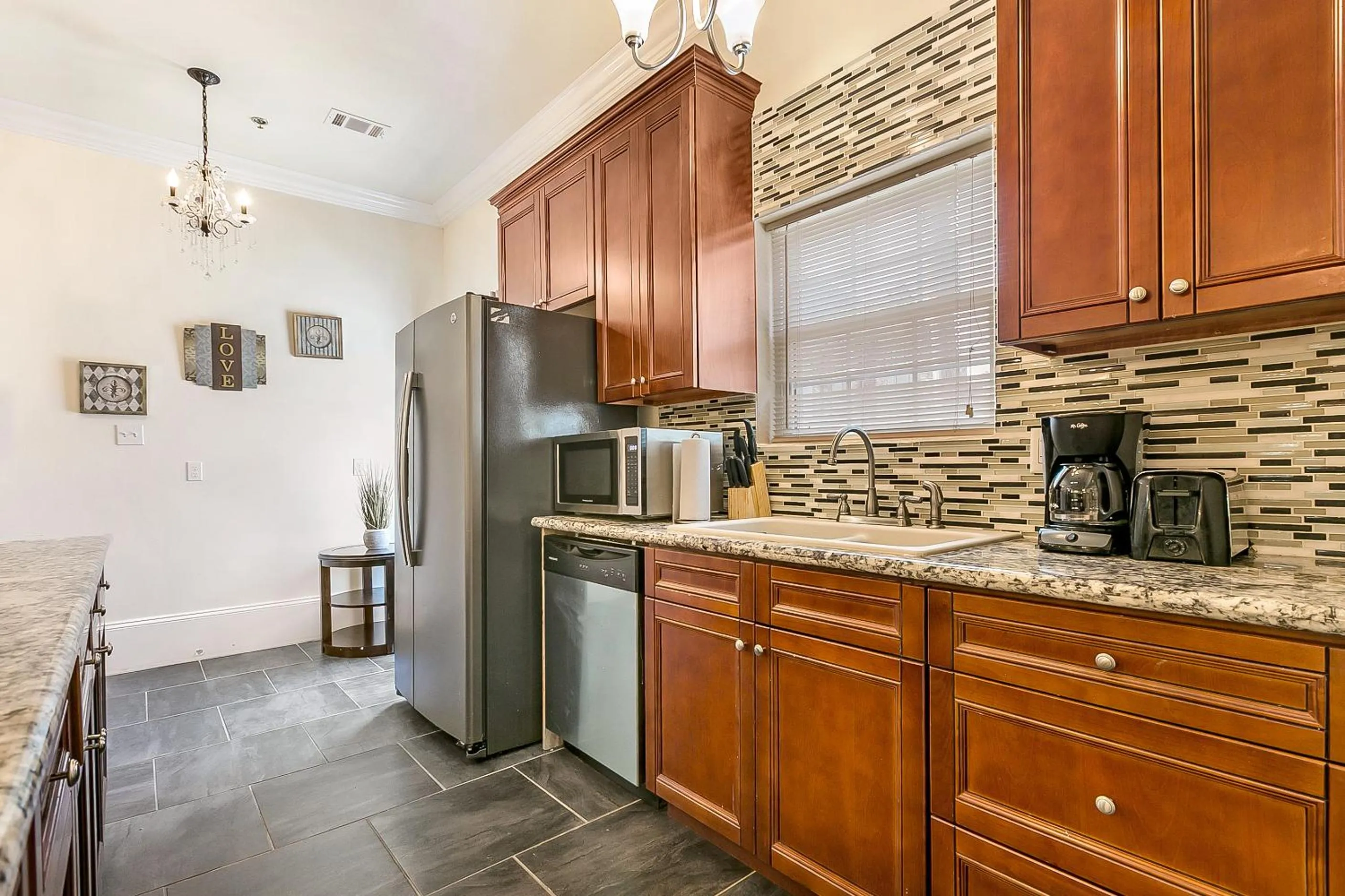 Kitchen or kitchenette in Spacious 4BR City Condo steps from St Charles Ave