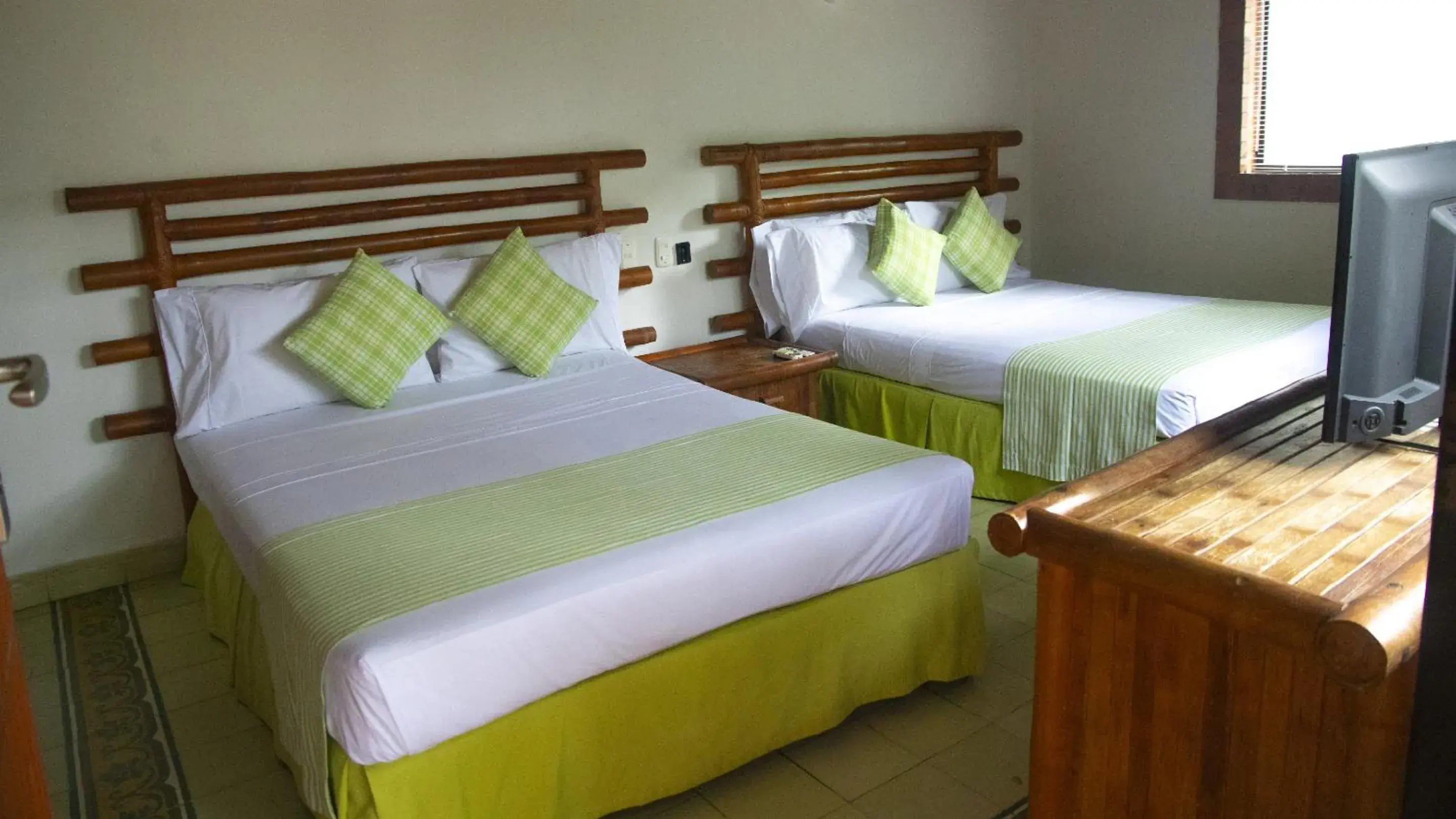 Bed in Hotel Girardot Resort by On Vacation Bed in Hotel Girardot Resort by On Vacation