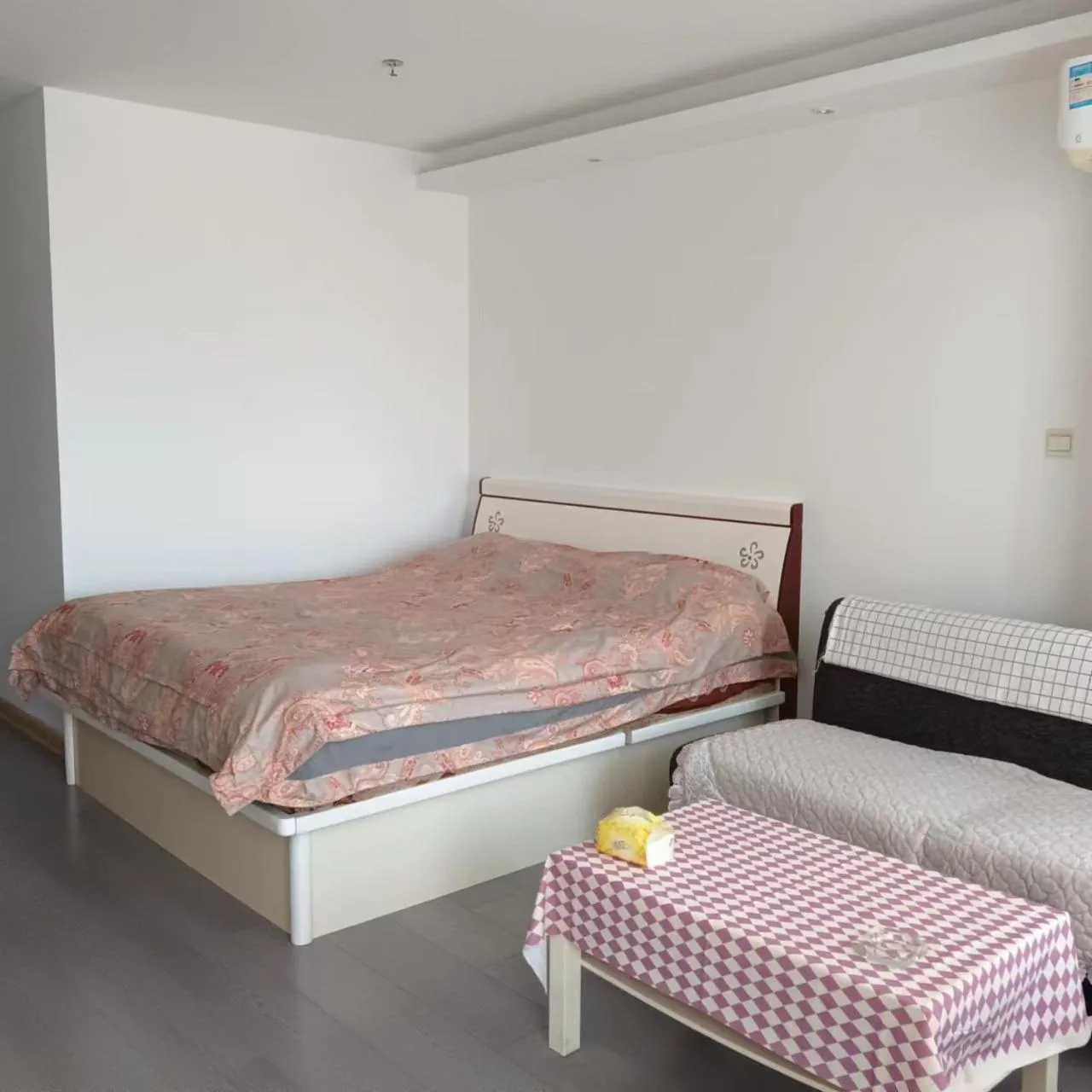 Bed in Dalian Xiuzhu Mansion Apartment