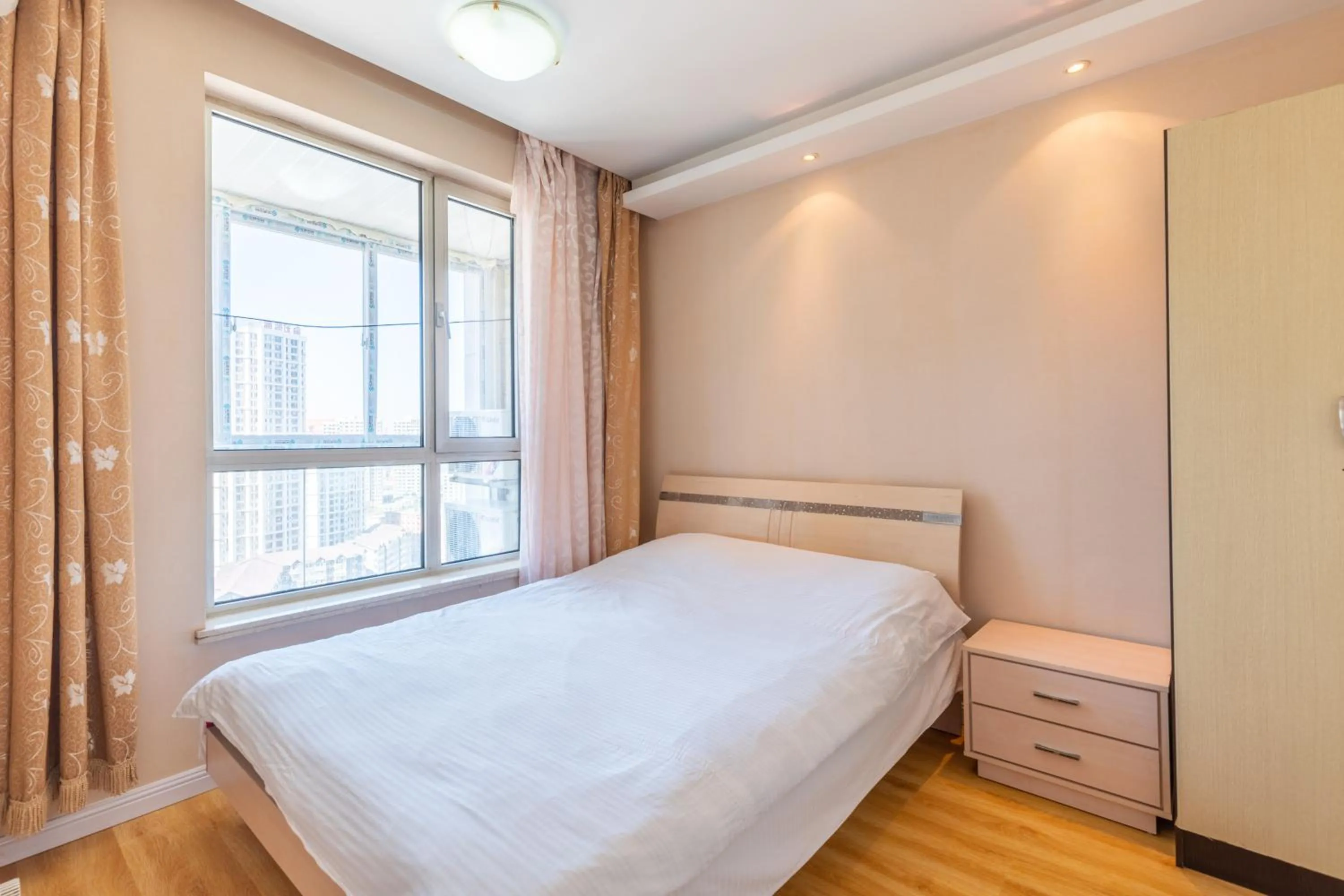 Bedroom, Bed in Dalian Xiuzhu Mansion Apartment