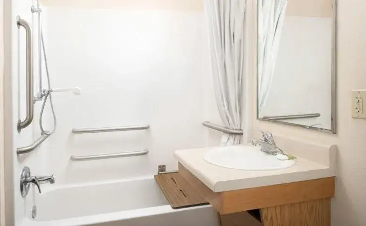 Bathroom in WoodSpring Suites Holland - Grand Rapids