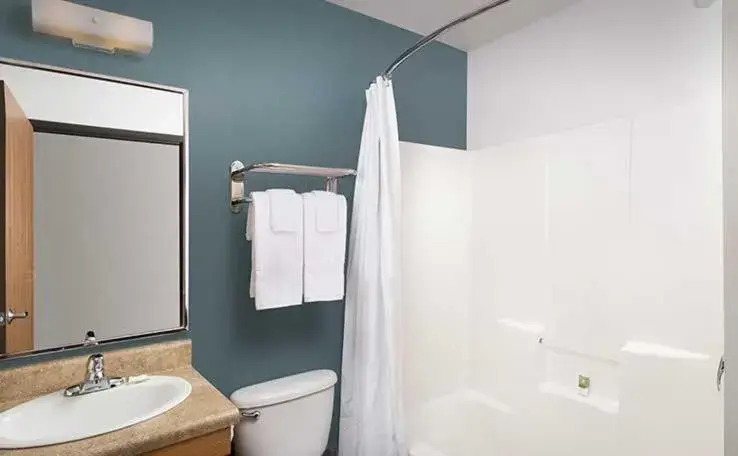 Bathroom in WoodSpring Suites Holland - Grand Rapids