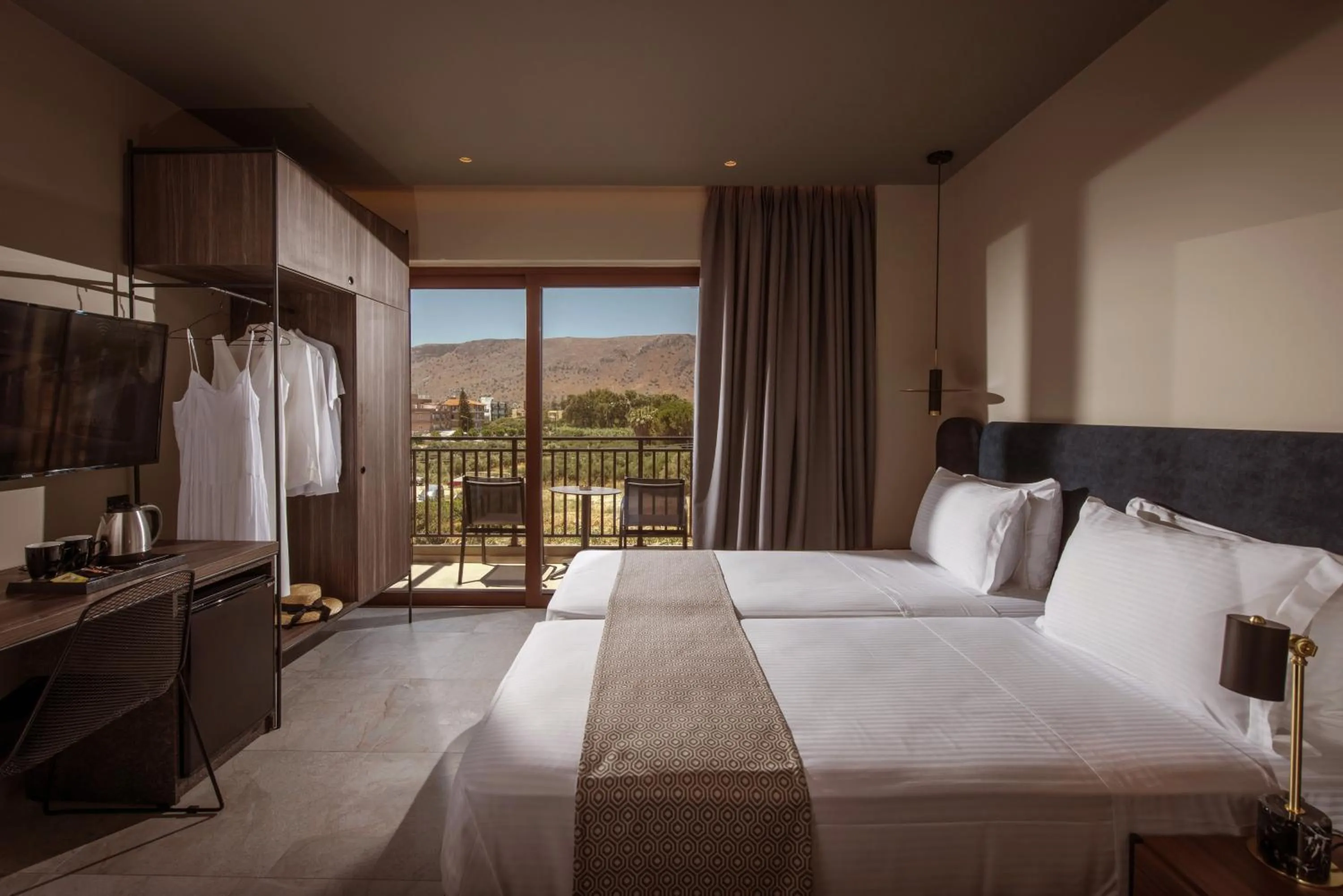Bed in Petousis Hotel & Suites