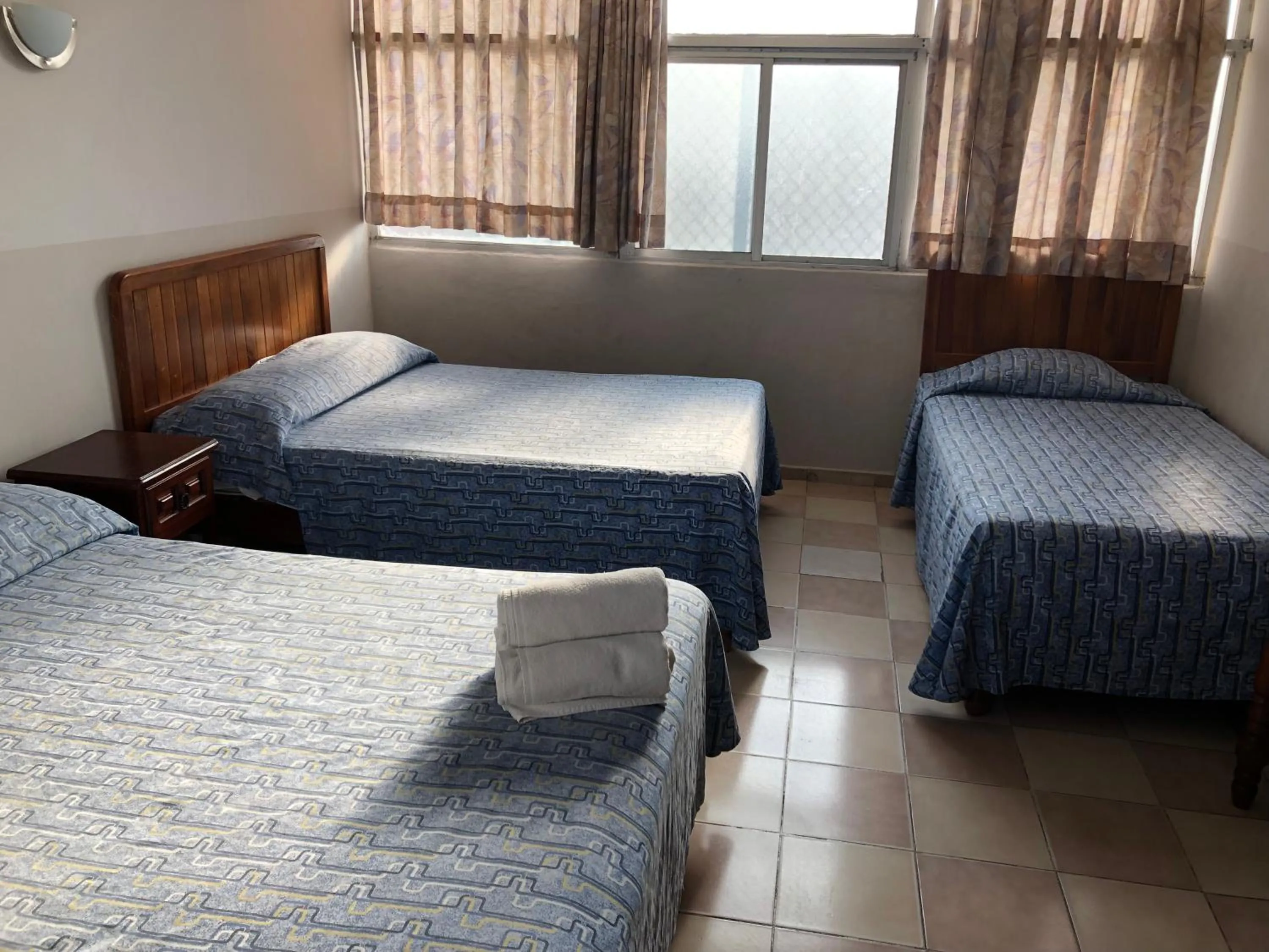 Bed in Hotel El Faro Malecon