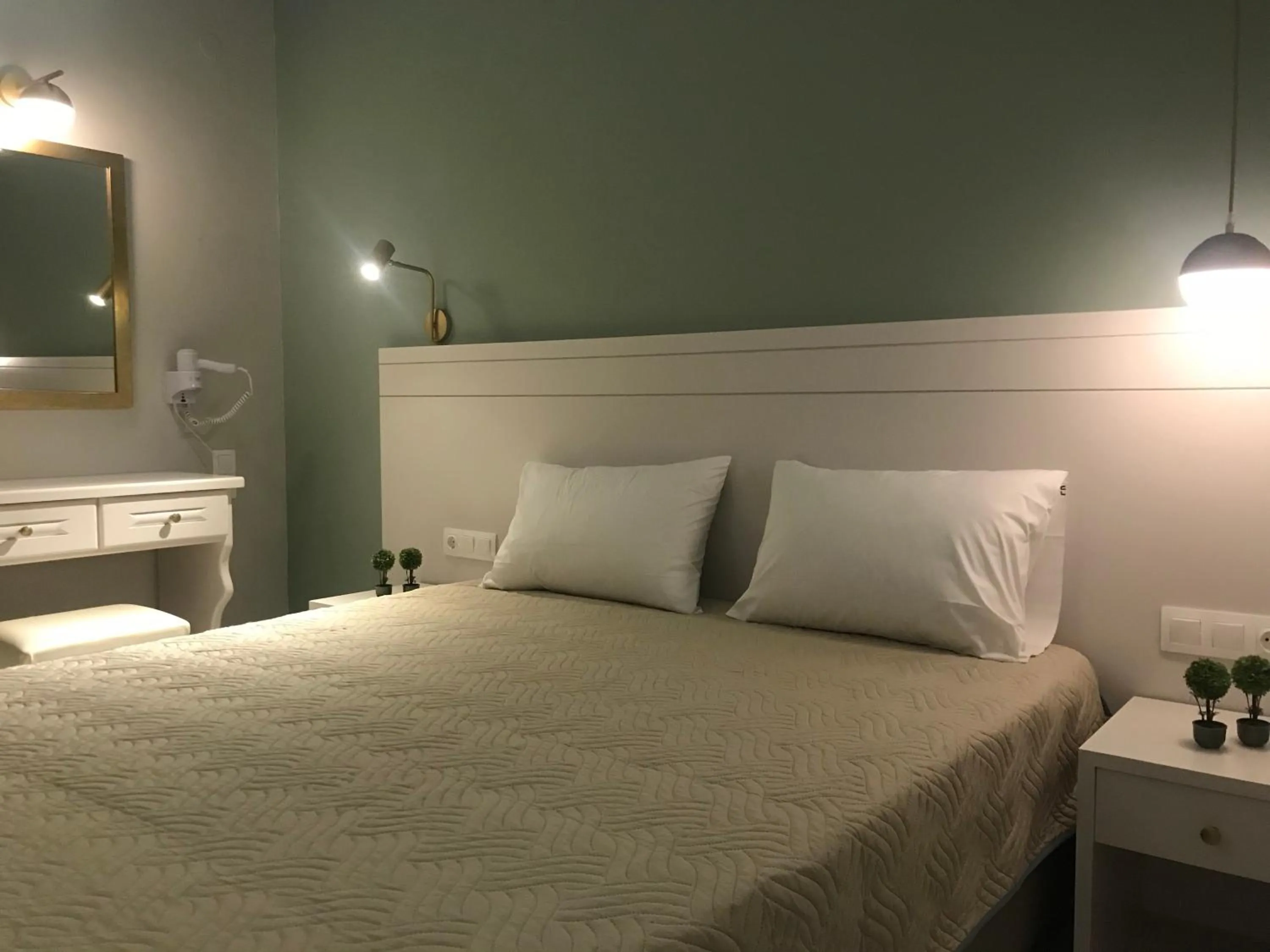 Bed in George Deluxe Apartments