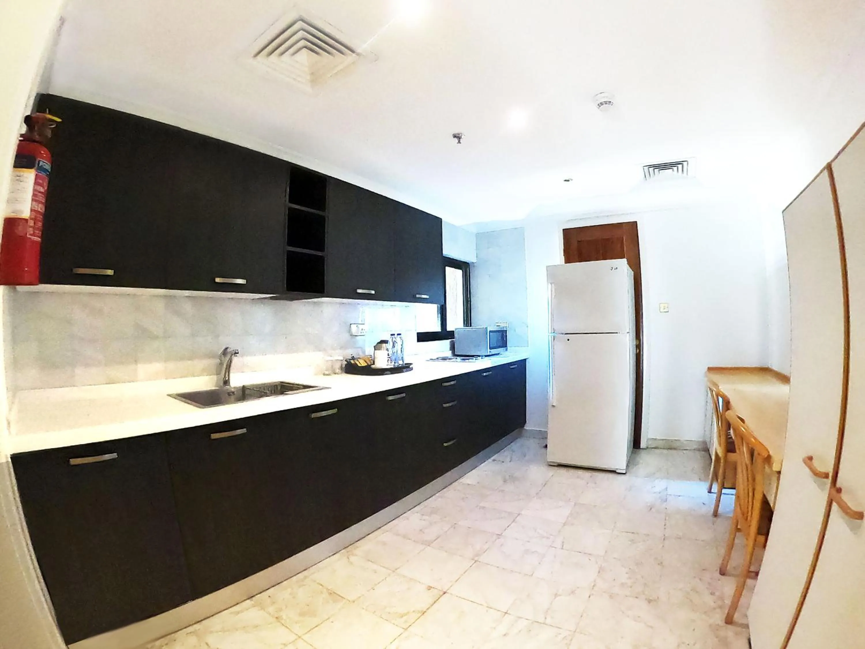 Kitchen or kitchenette in The Apartments