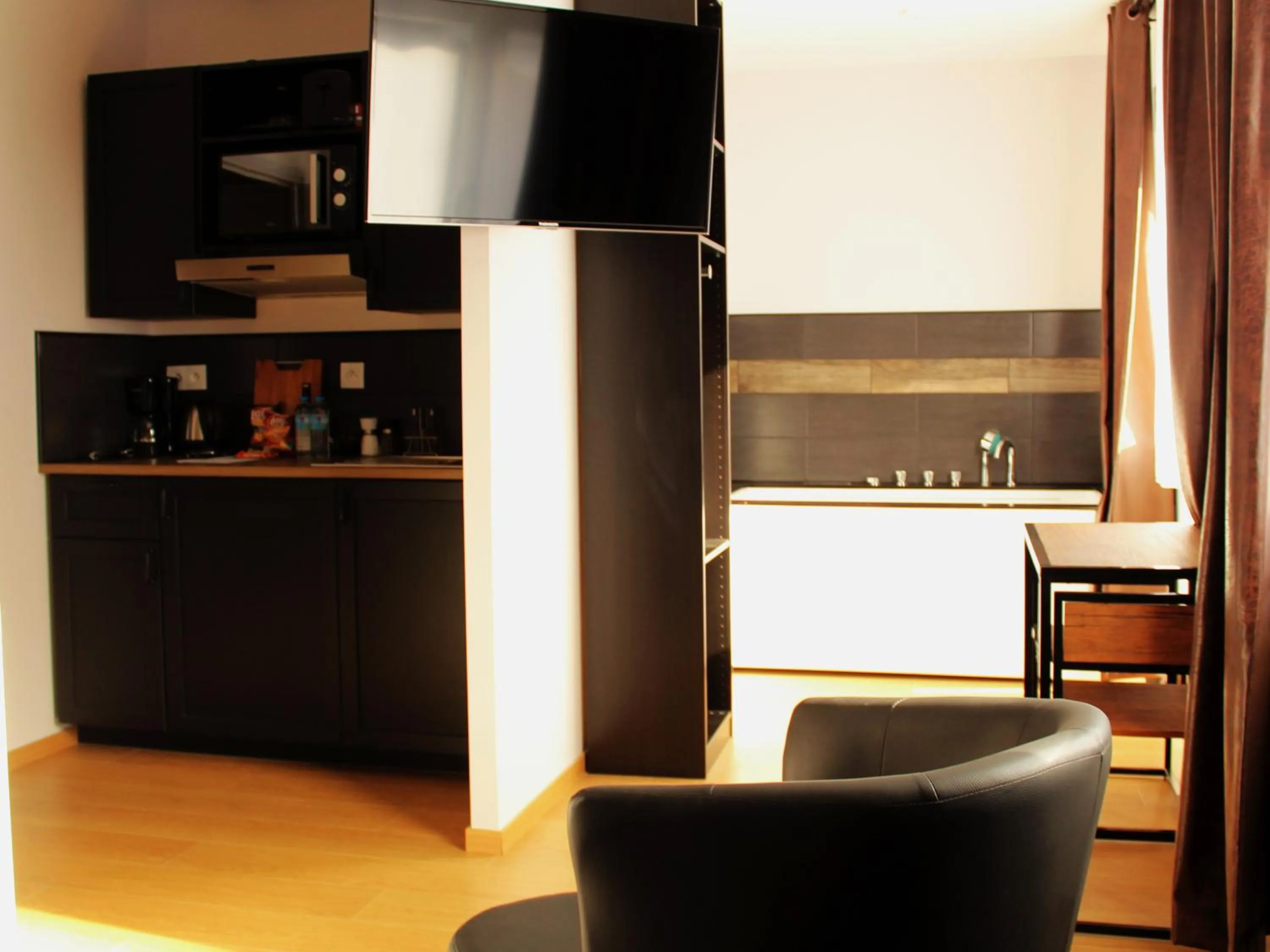 Kitchen or kitchenette in Appart Hotel Relax Spa