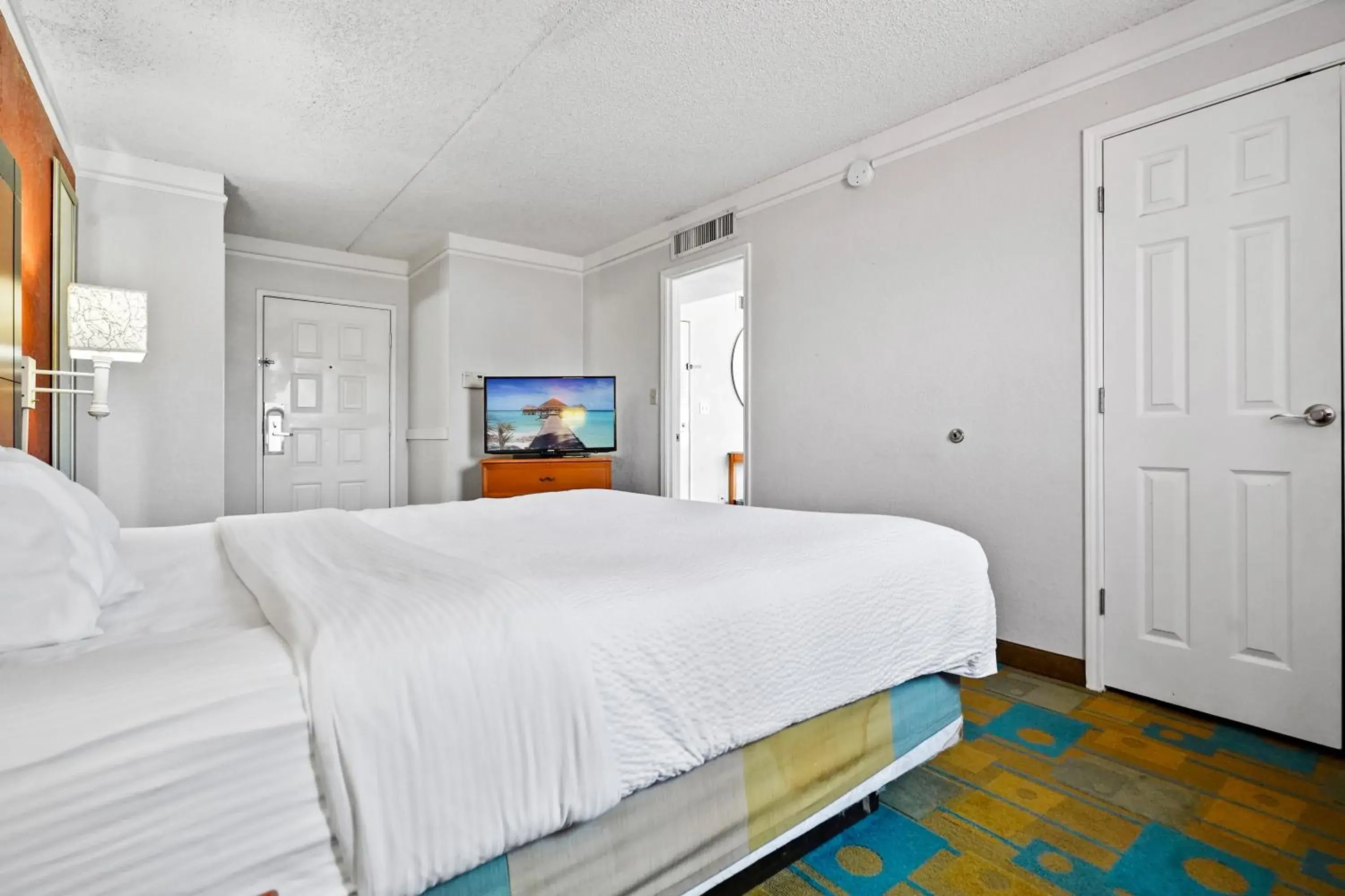 Bed in La Quinta Inn by Wyndham Costa Mesa Orange County