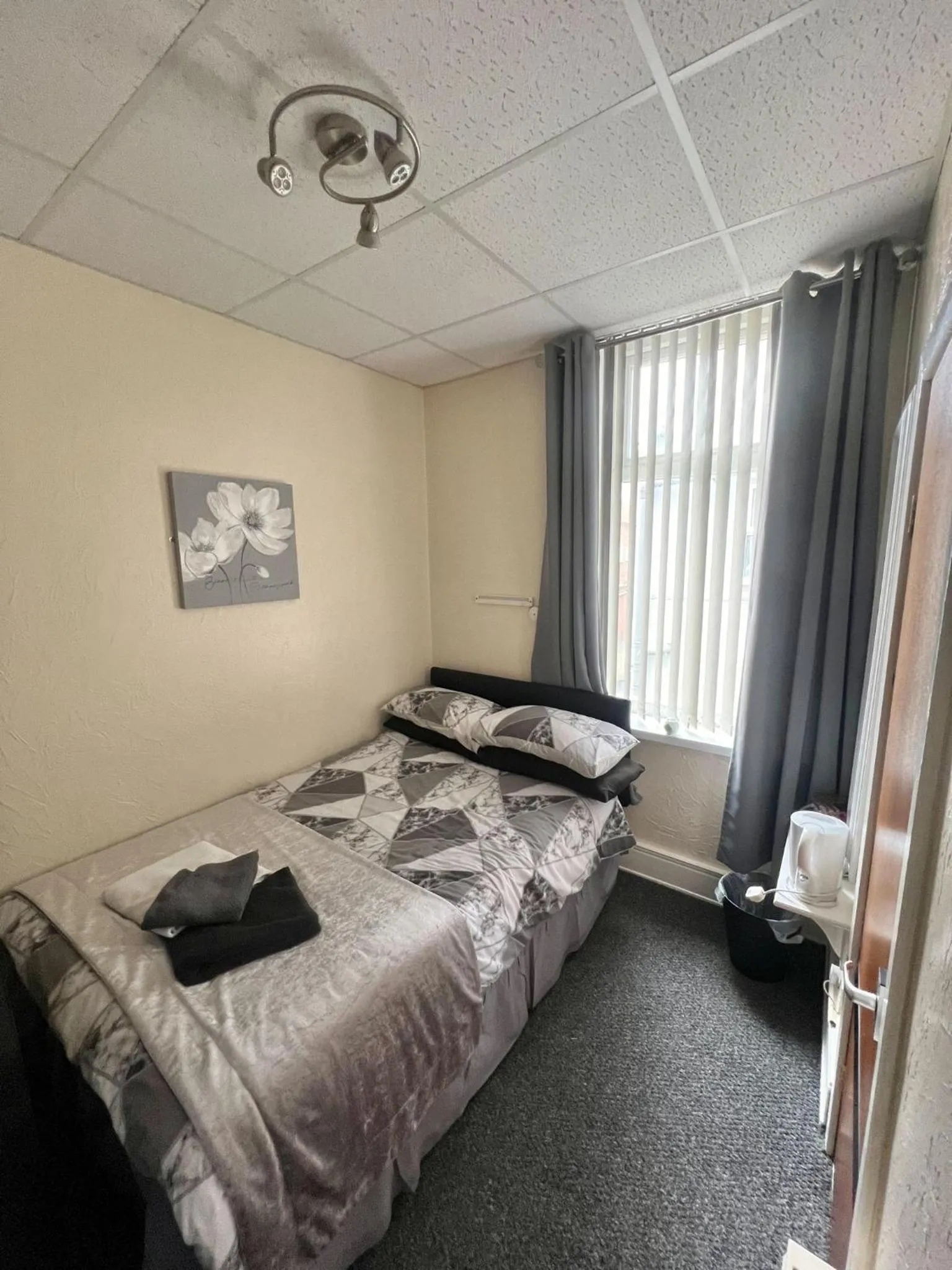 Bed in Tudor Rose Hotel