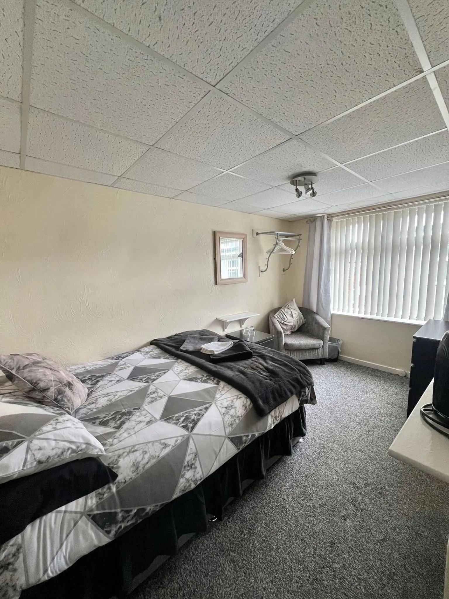 Bed in Tudor Rose Hotel