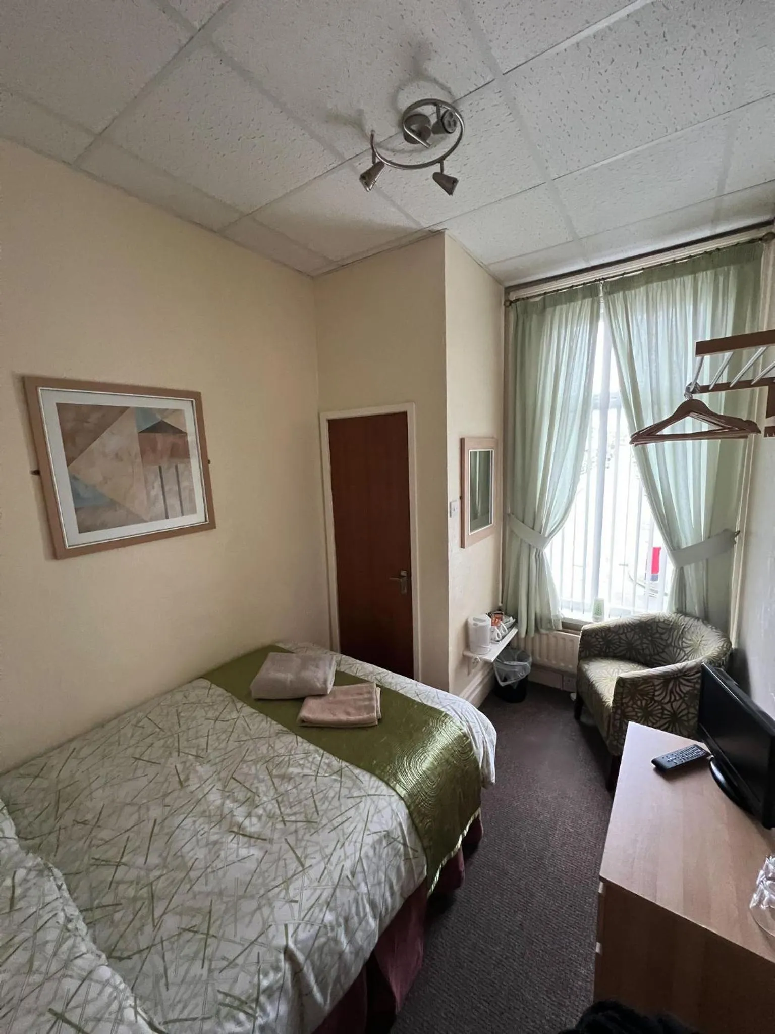 Bed in Tudor Rose Hotel