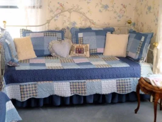 Bed in Belle Aire Mansion Guest House