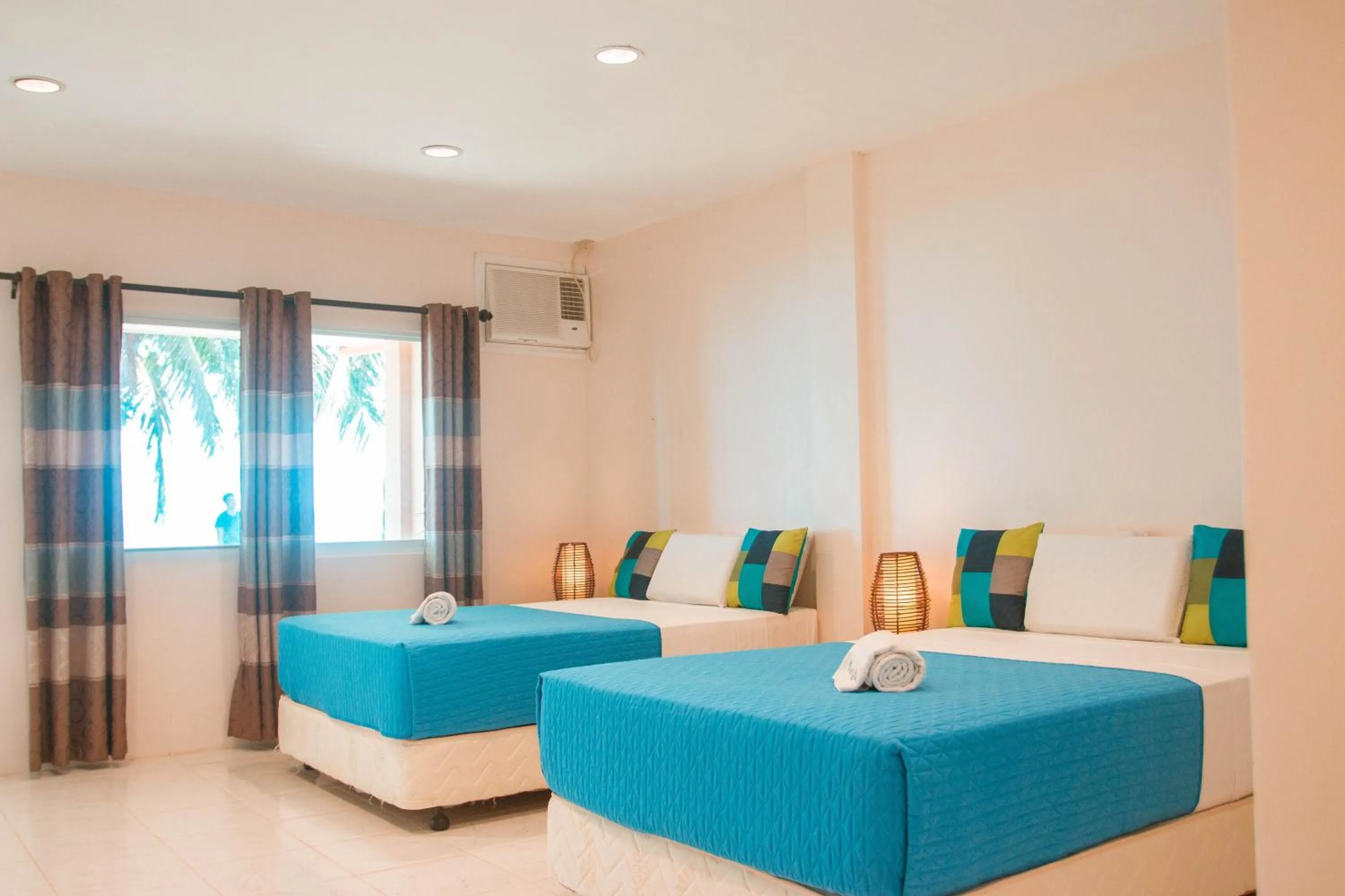 Bed in Estaca Bay Gardens Conference Resort powered by Cocotel