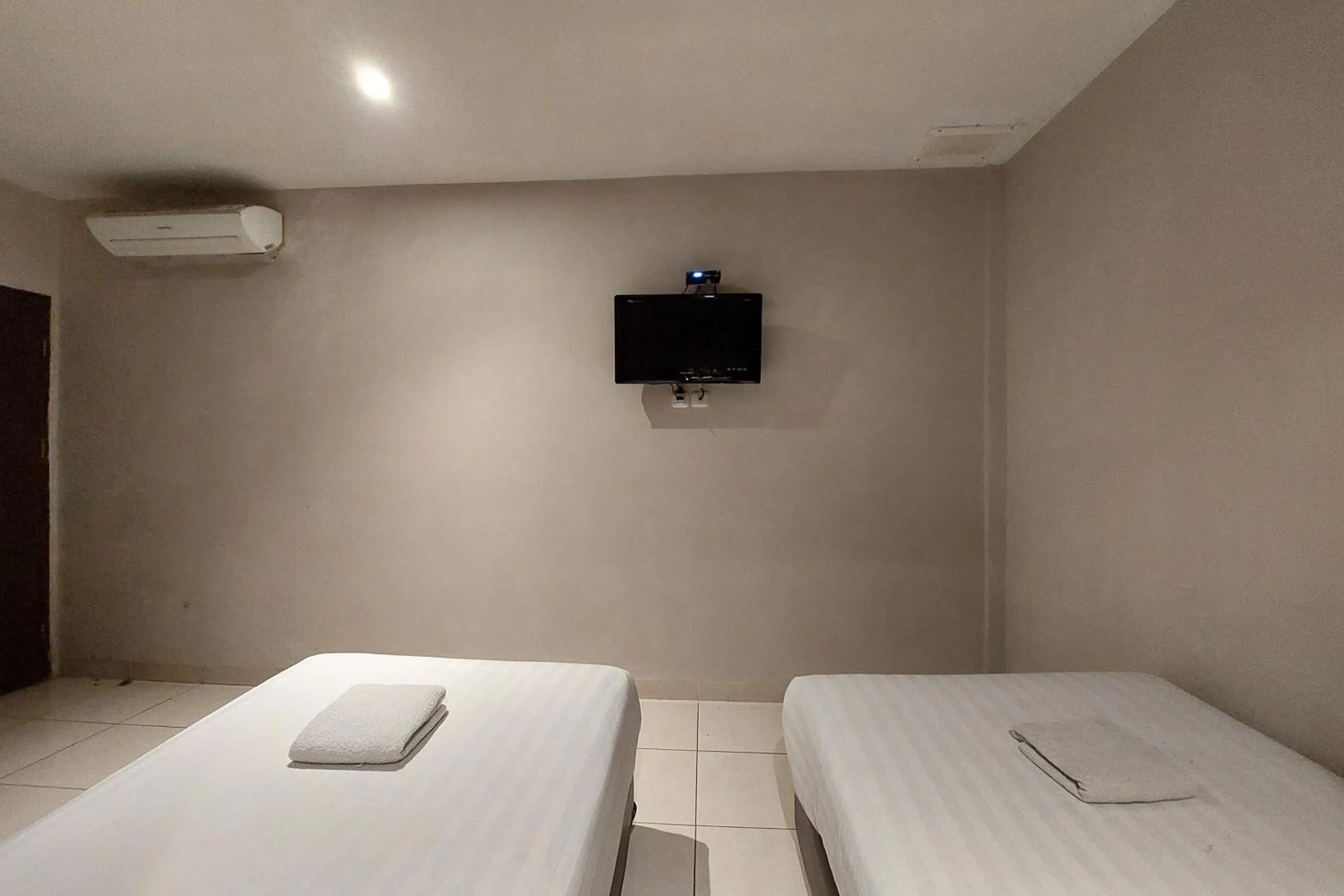 Bed in Hotel Bumi Malaya