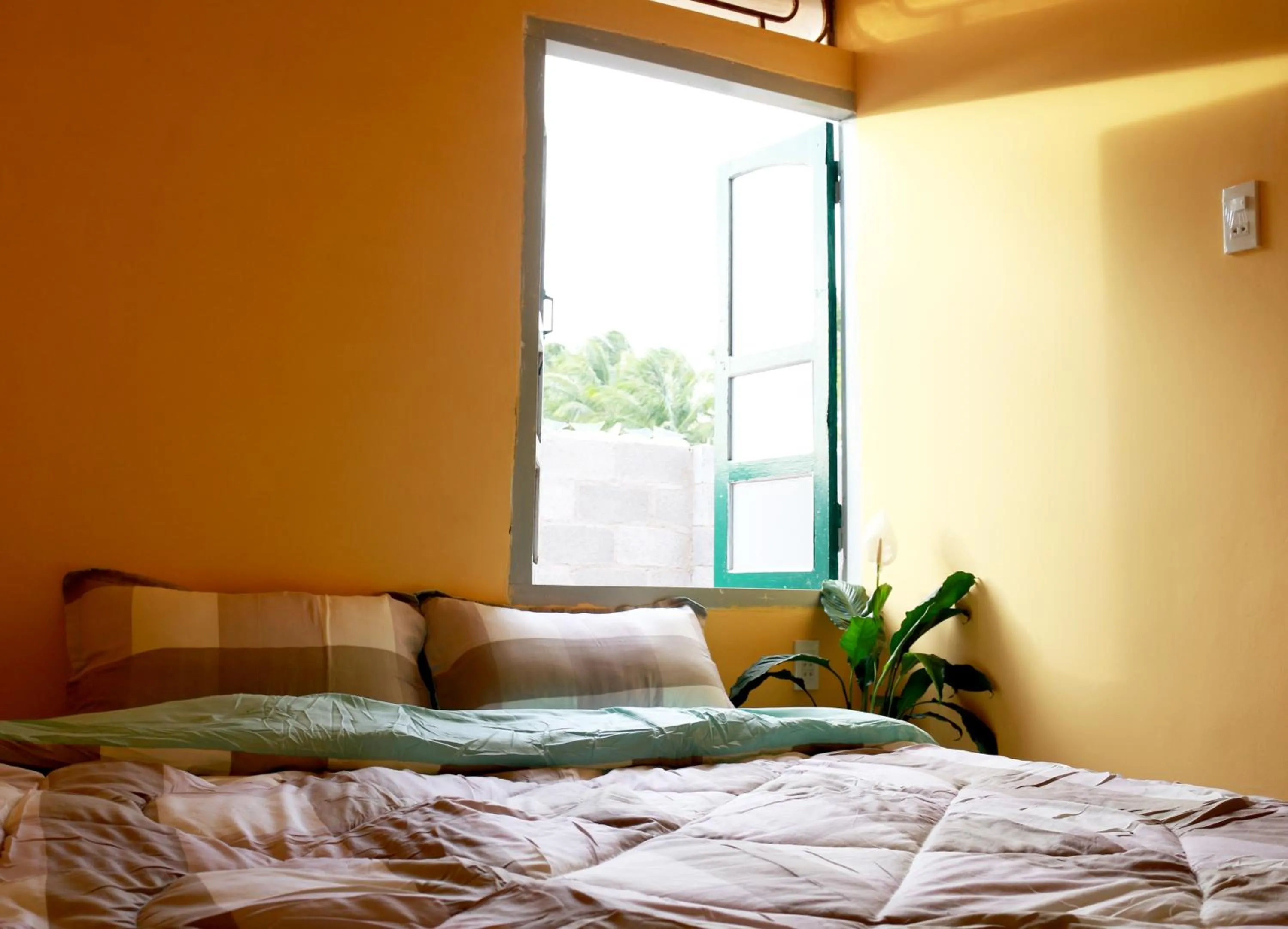 Bed in BONNIE HOMESTAY Mui Ne