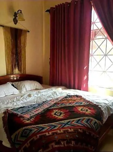 Bed in BONNIE HOMESTAY Mui Ne