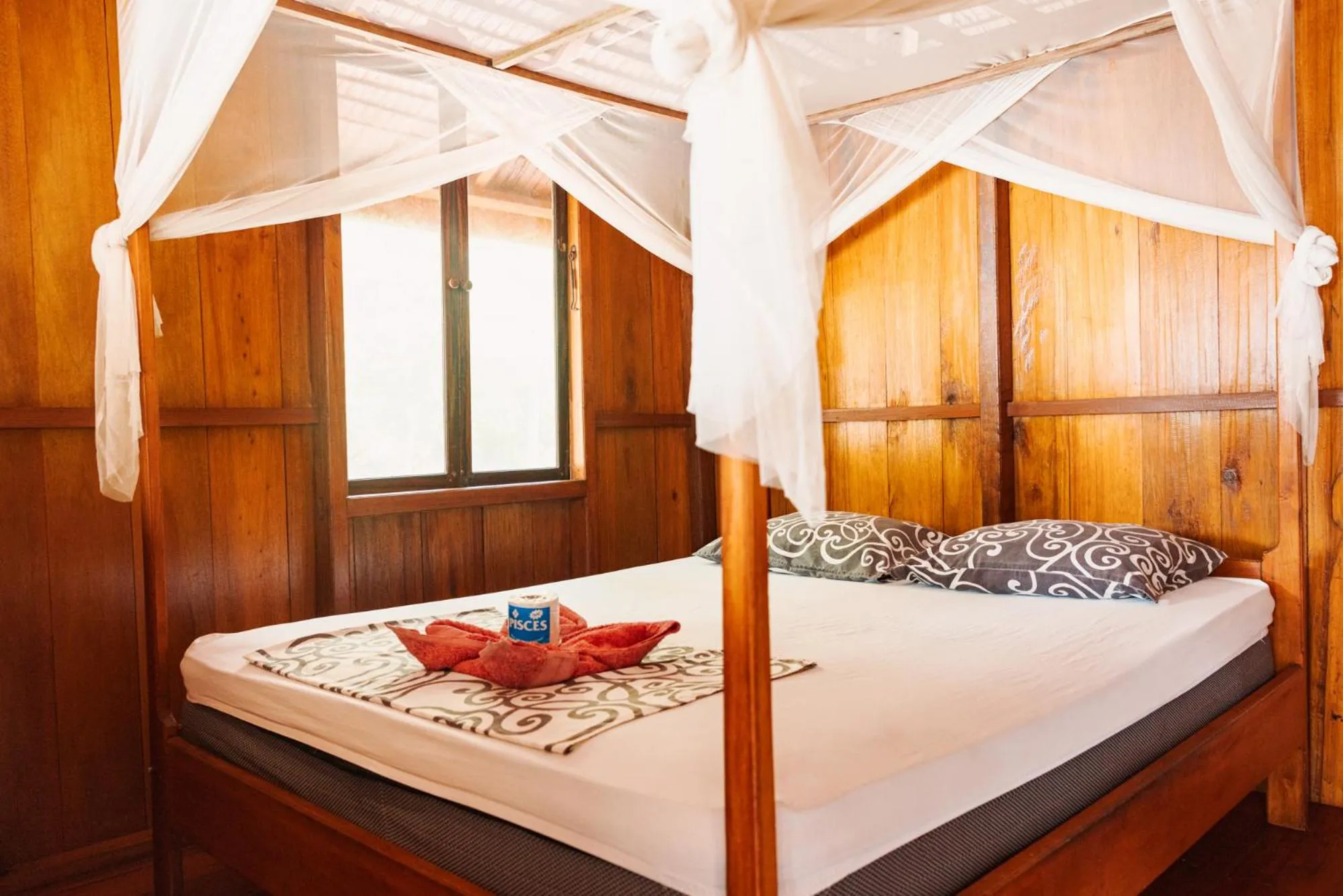 Property building, Bed in Harmony Bay Resort and Dive Center