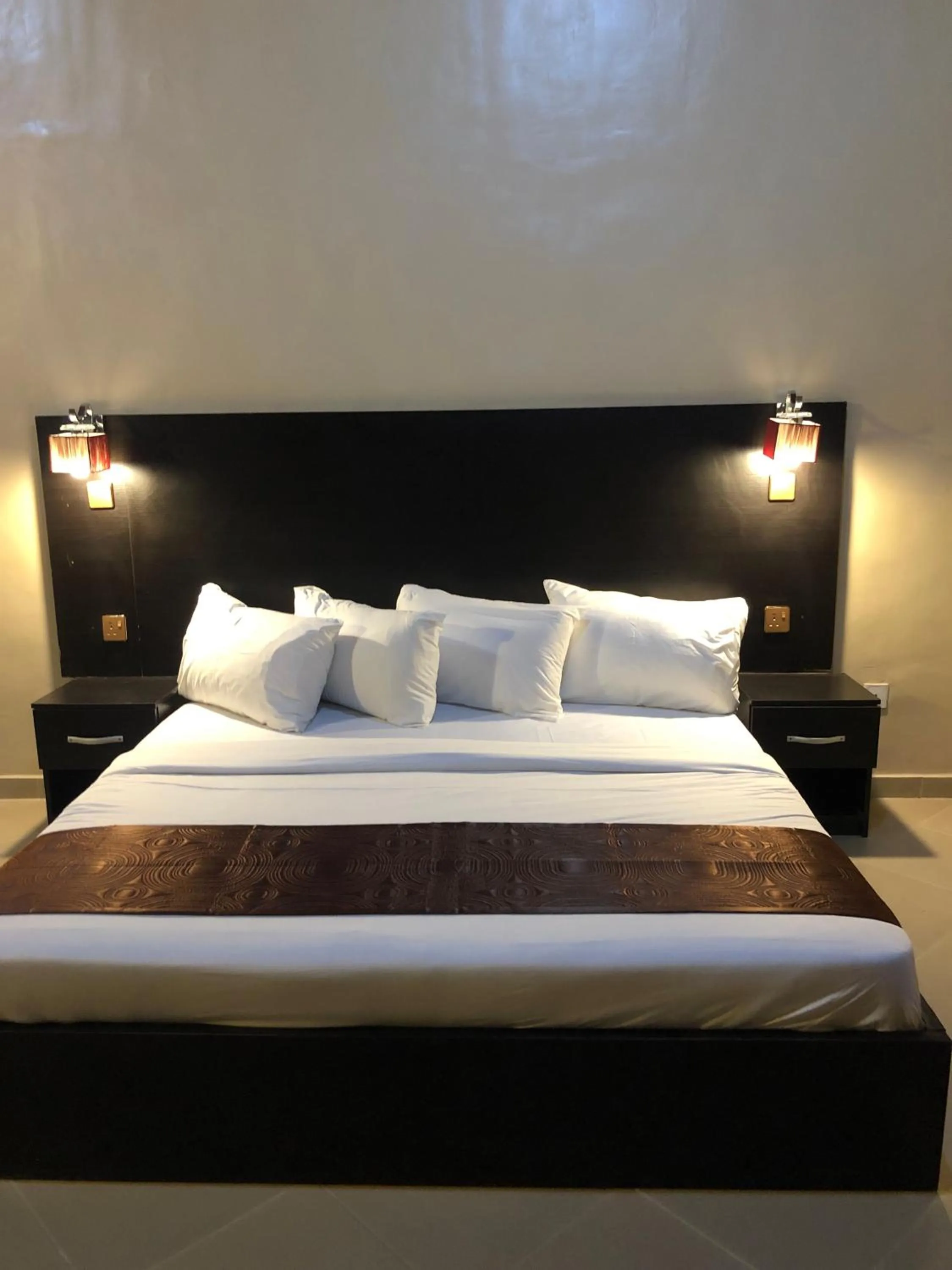 Bed in Posh Apartments Business Hotel