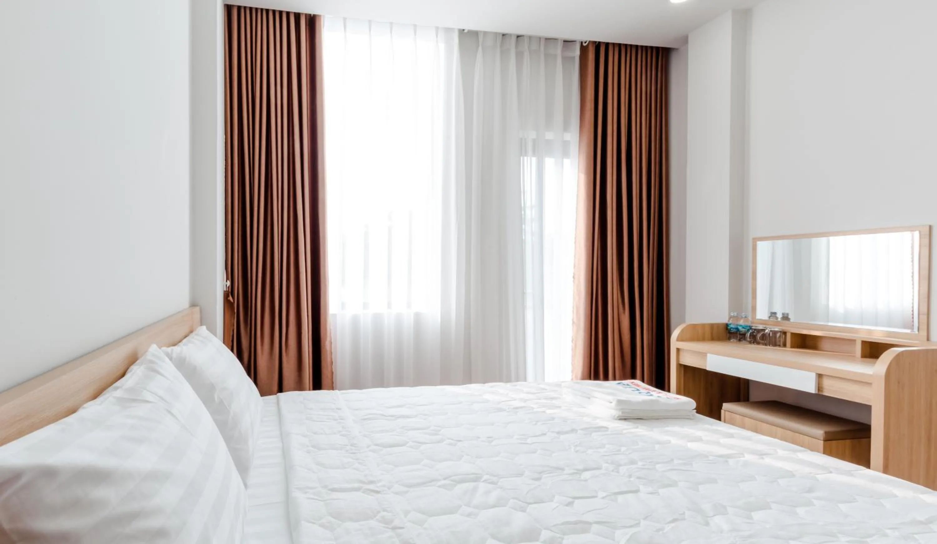 Bed in AQUA Seaview Hotel