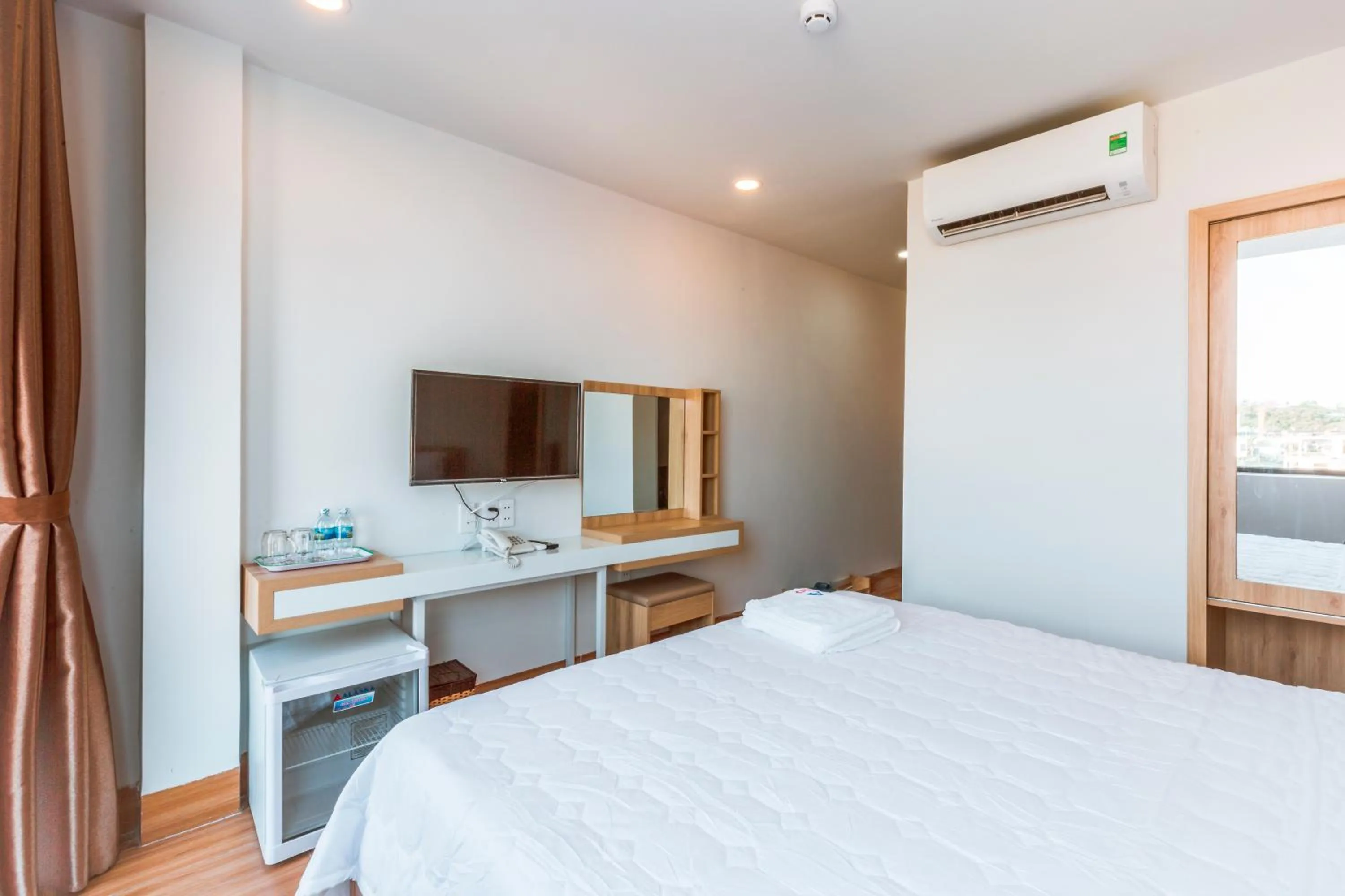 Bed in AQUA Seaview Hotel