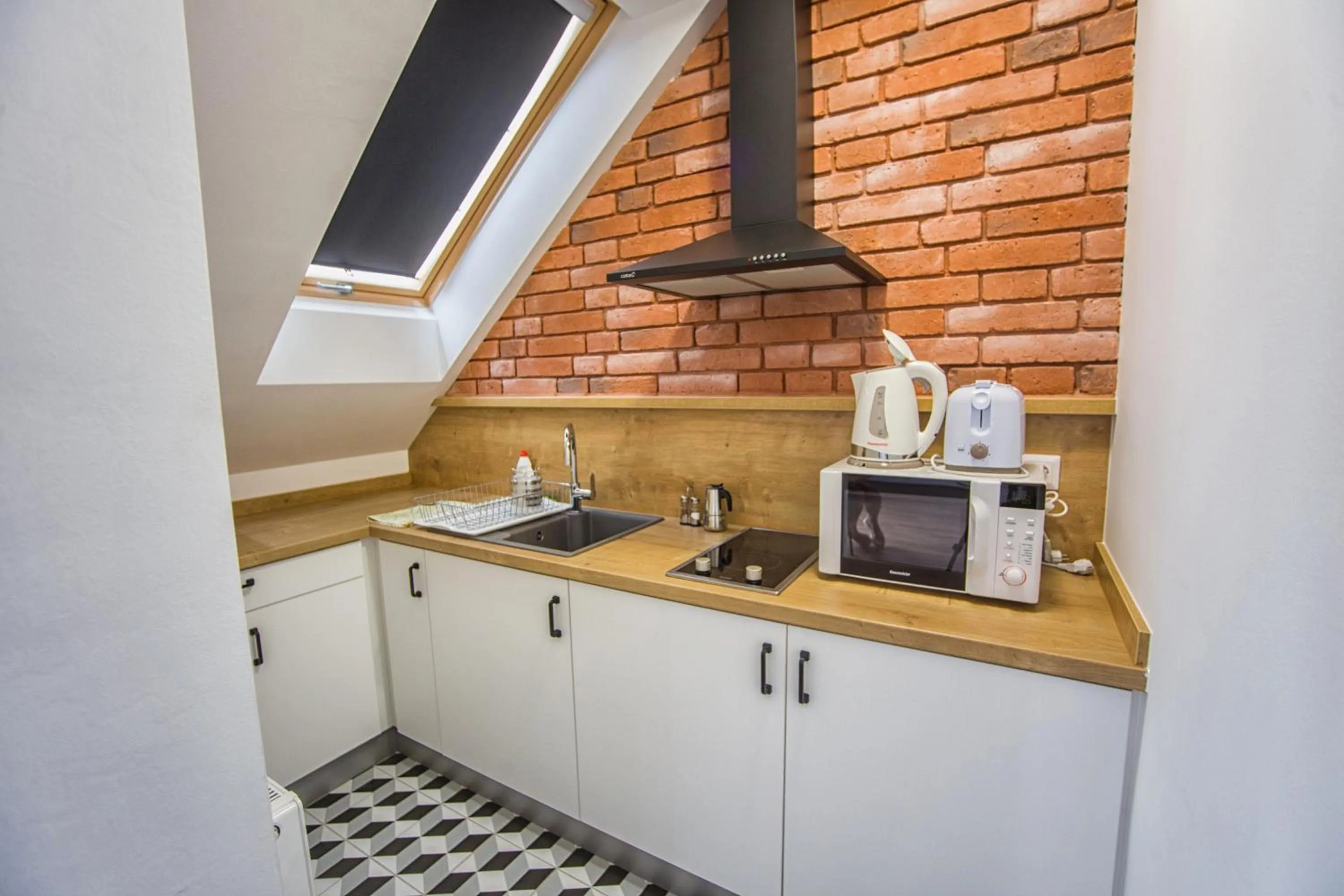 Kitchen or kitchenette in Berill Suites