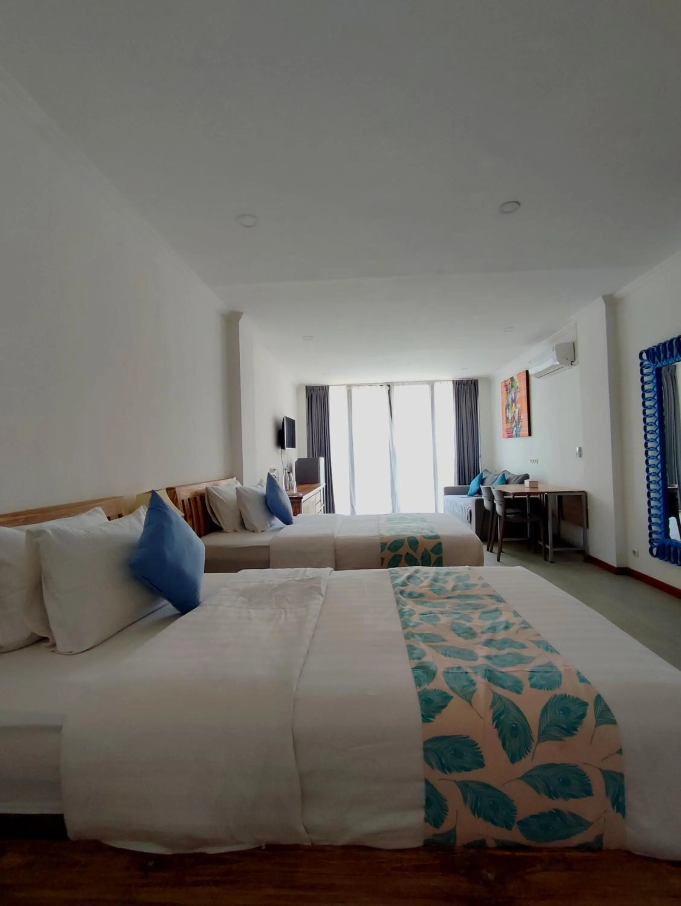 Bed in Triple 8 Suites