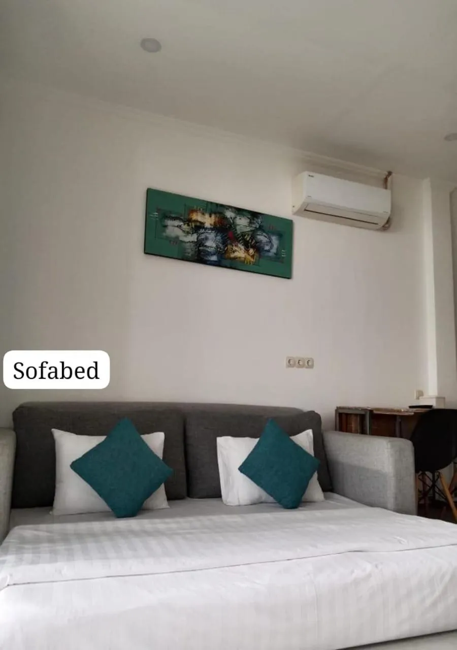 Bed in Triple 8 Suites