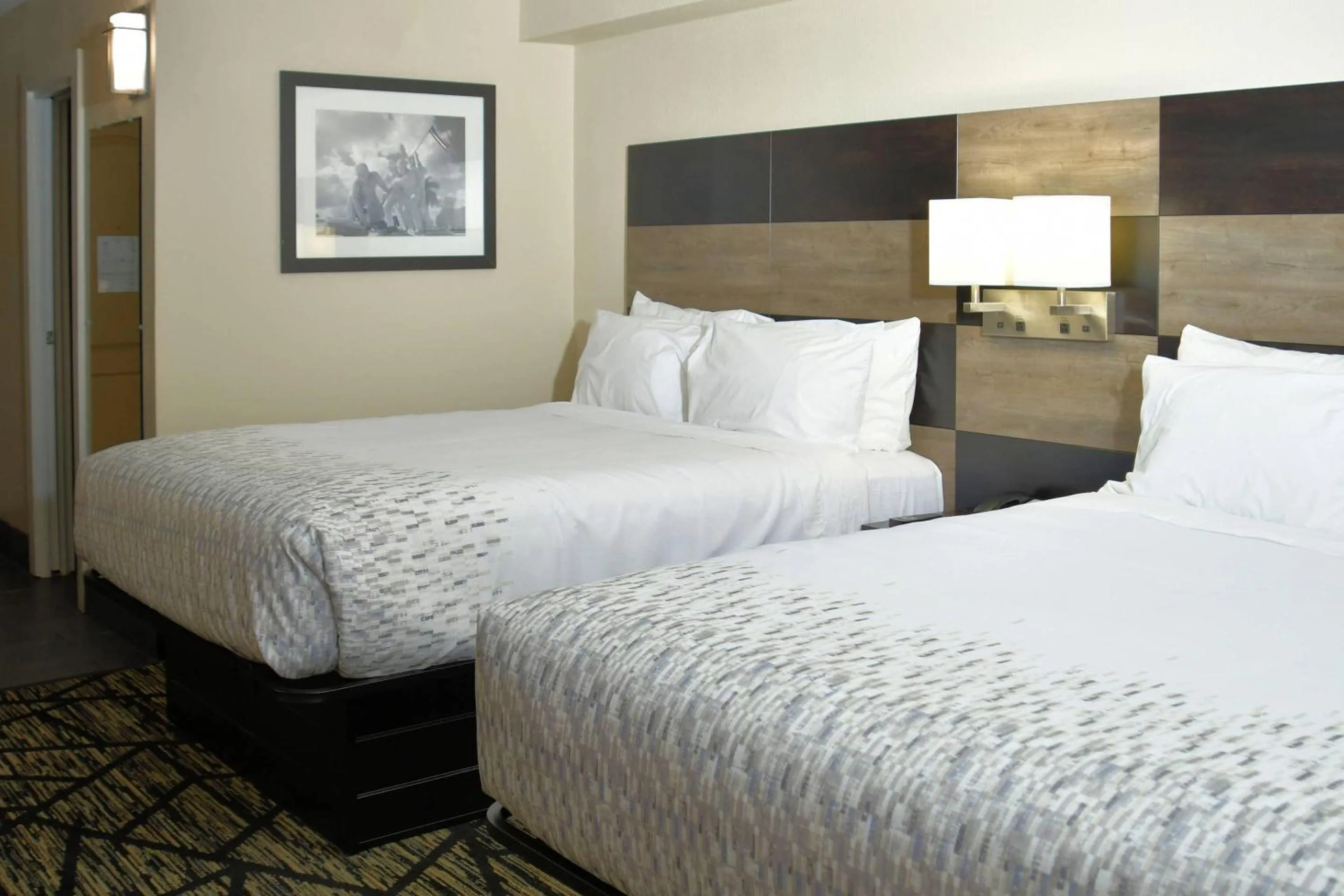 Bedroom, Bed in Clarion Pointe Jacksonville near Camp Lejeune