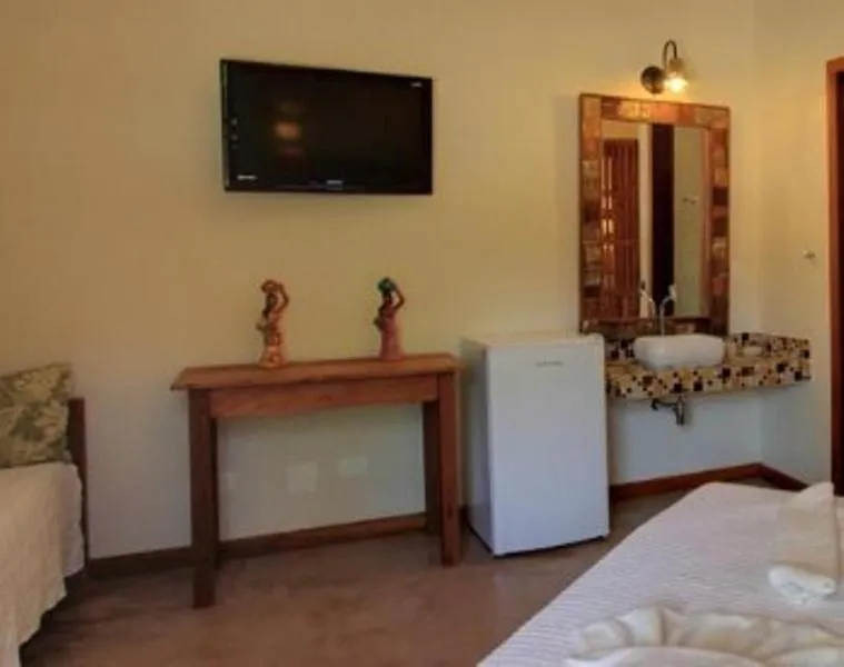 Bed in Pousada Tupinamba