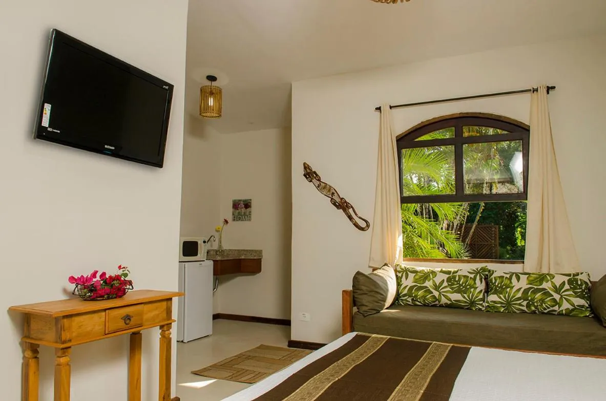 Bed in Pousada Tupinamba