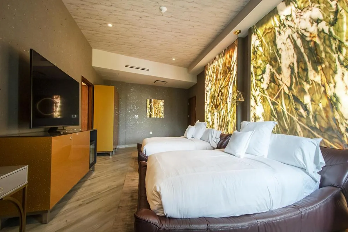 Bed in L Hotel Perla Boutique