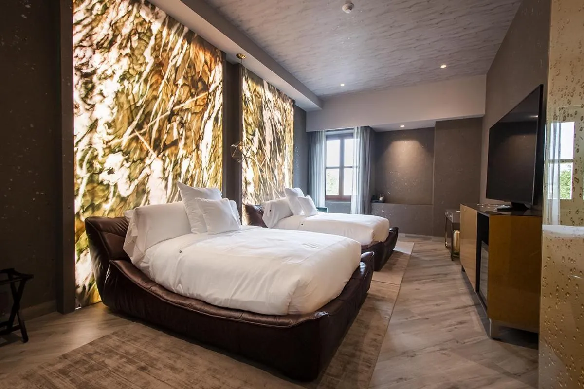 Bed in L Hotel Perla Boutique