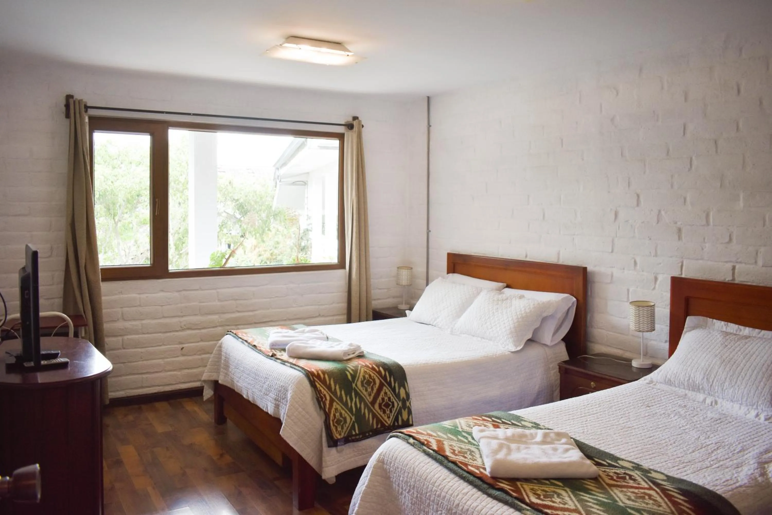 Photo of the whole room, Bed in Apartamentos Otorongo Cuenca Ecuador