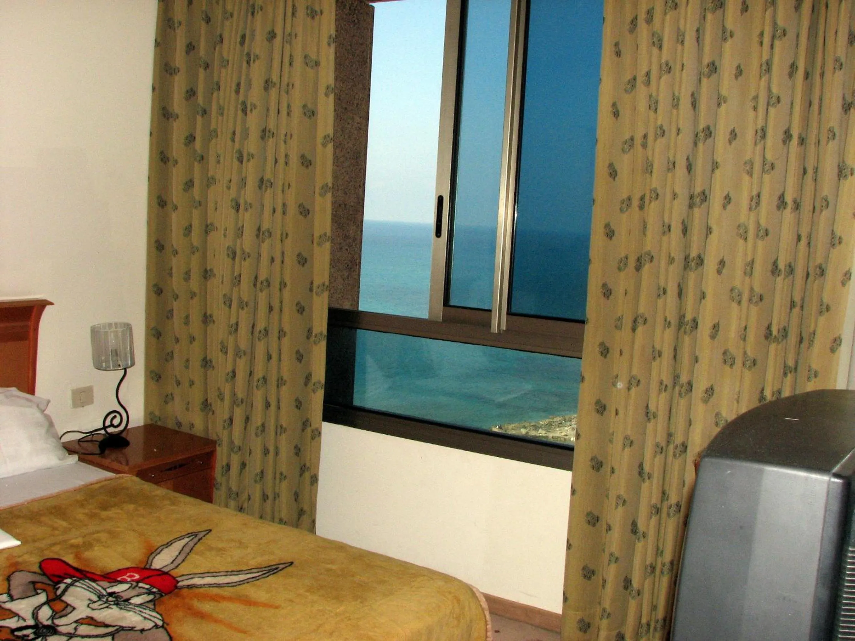 View (from property/room), Bed in Apartments on the Beach