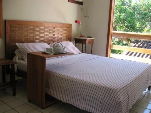 Bed in Pousada Girassol