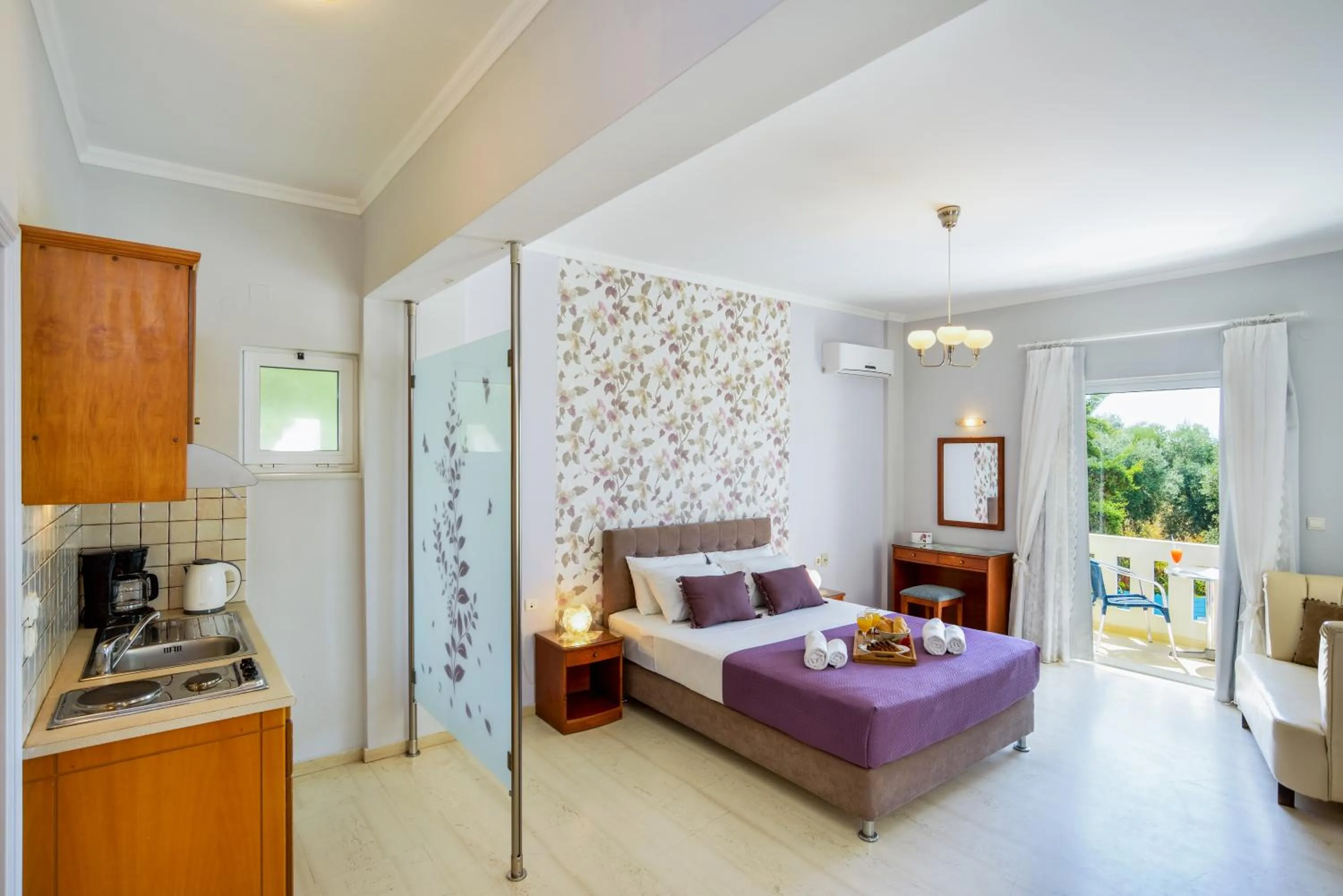 Kitchen or kitchenette, Bed in Poseidon Apartments