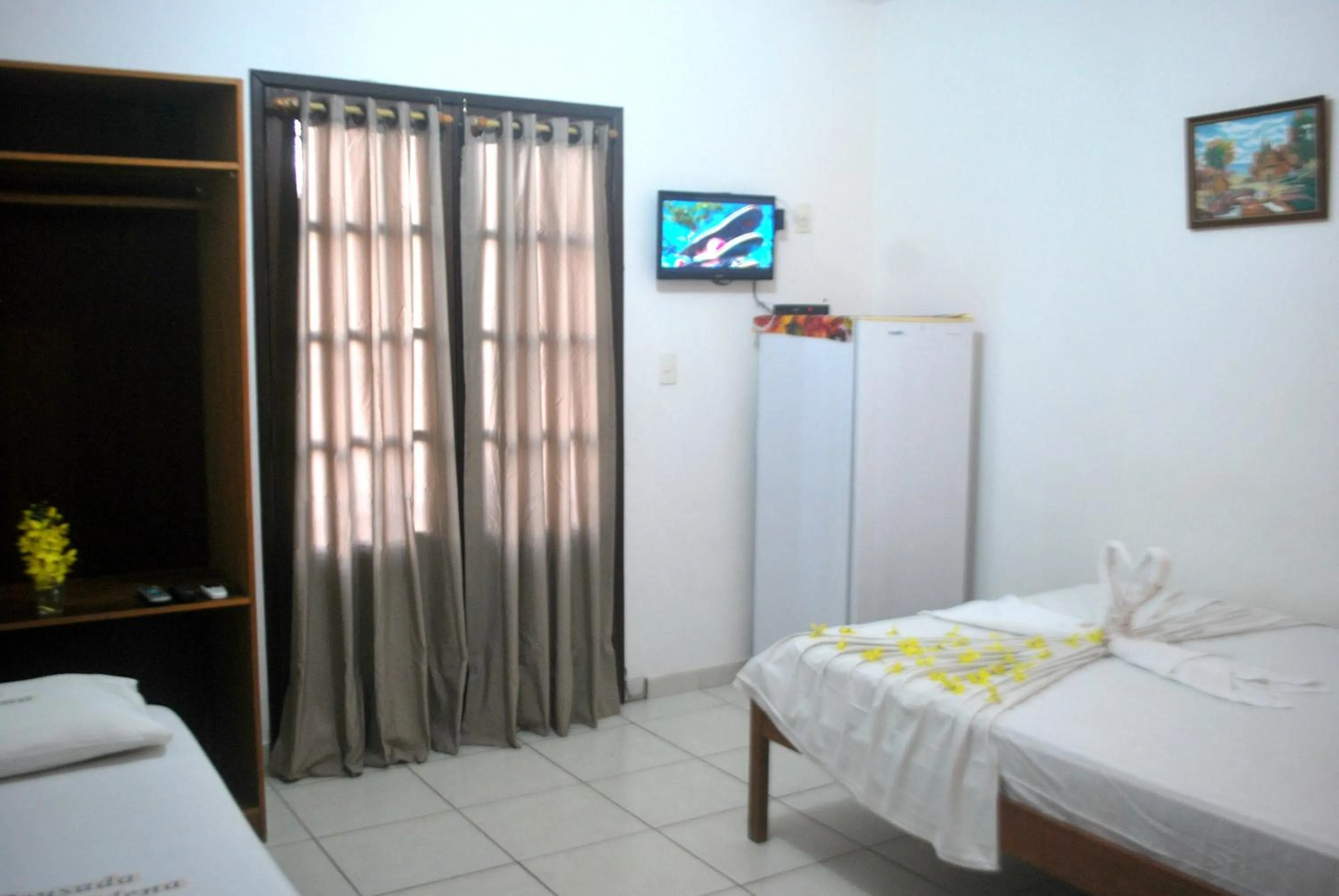 Photo of the whole room, Bed in Pousada Tia Helena