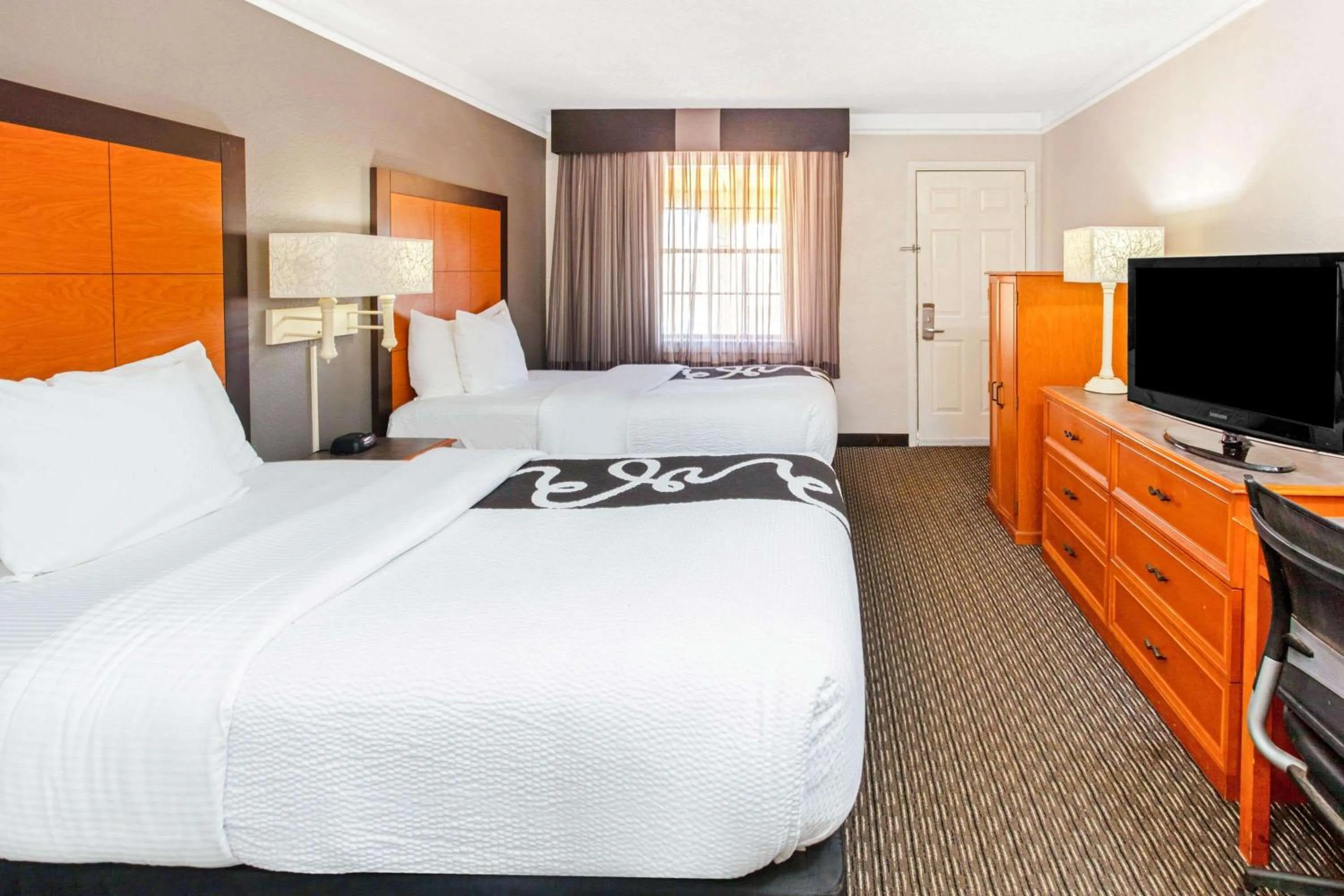 Photo of the whole room, TV/Entertainment Center in La Quinta Inn by Wyndham Wichita Falls Event Center North