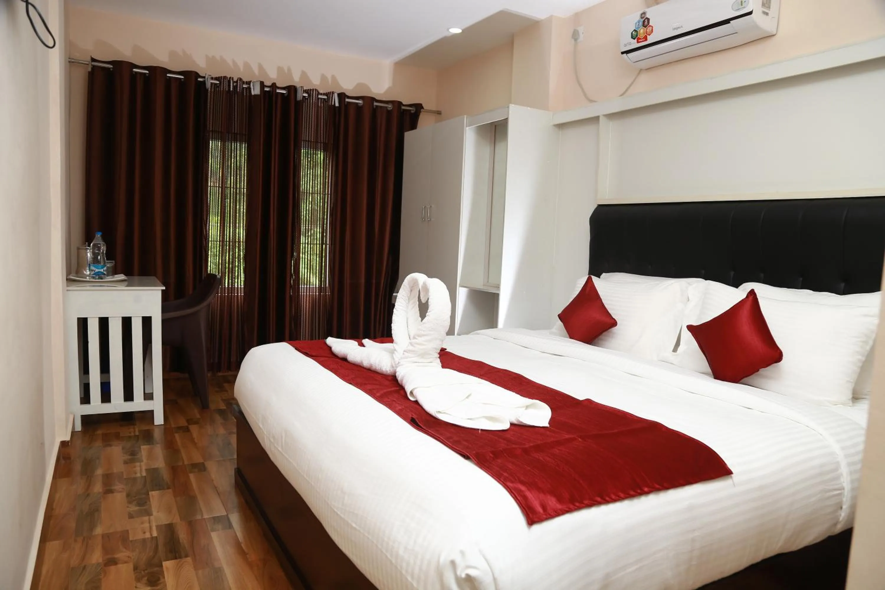 Bed in Hotel Wayanad Square