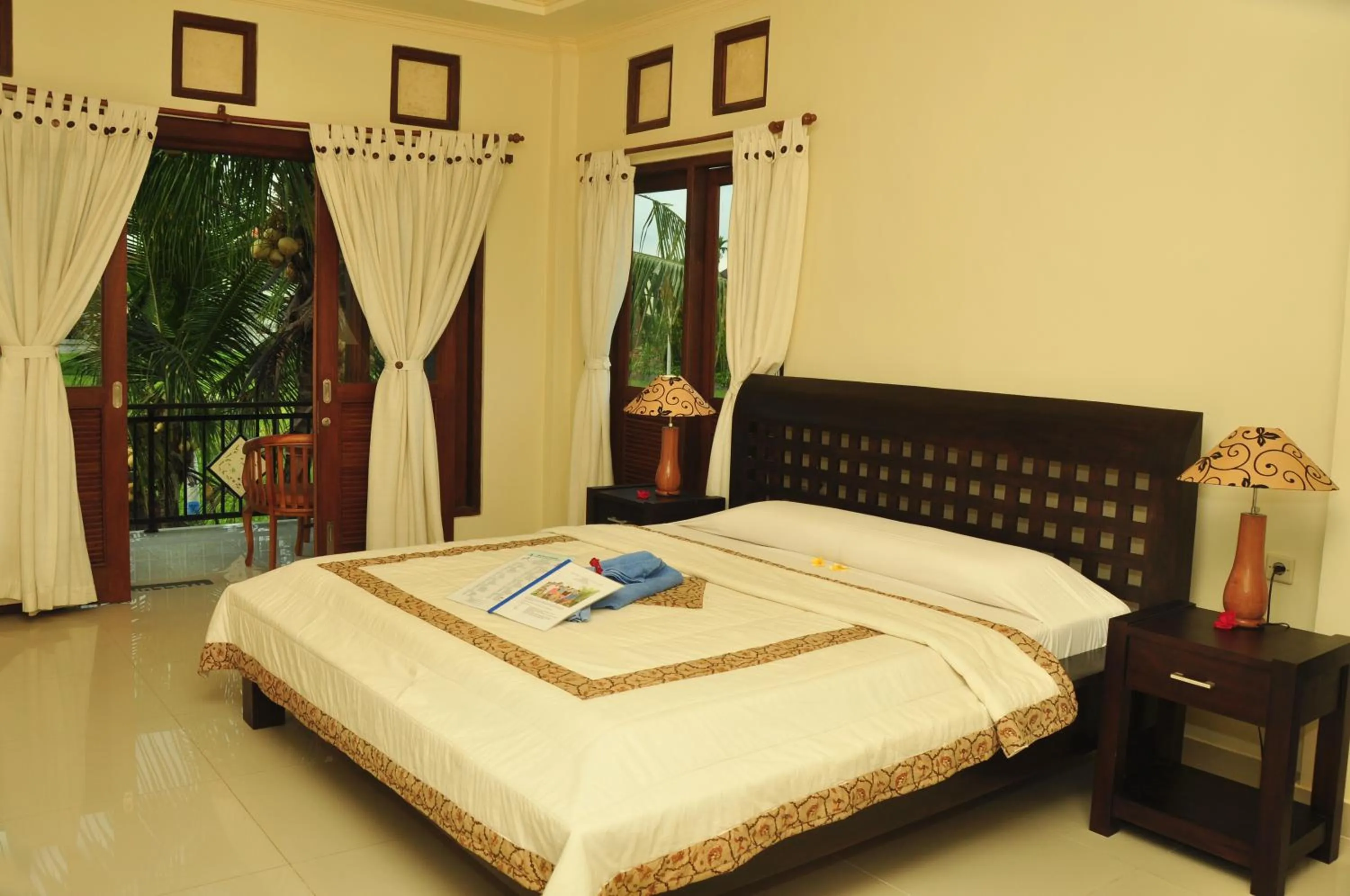 Photo of the whole room, Bed in Three Dewi's Guest House