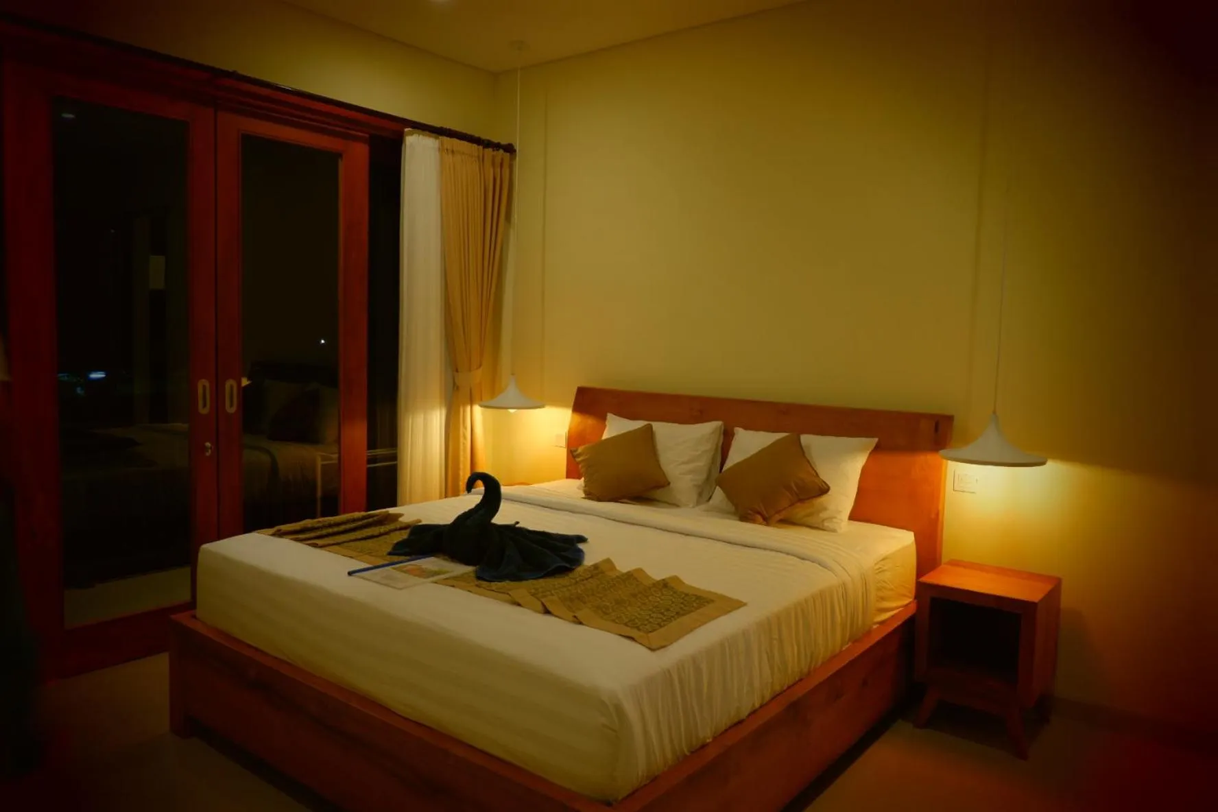 Bed in Three Dewi's Guest House