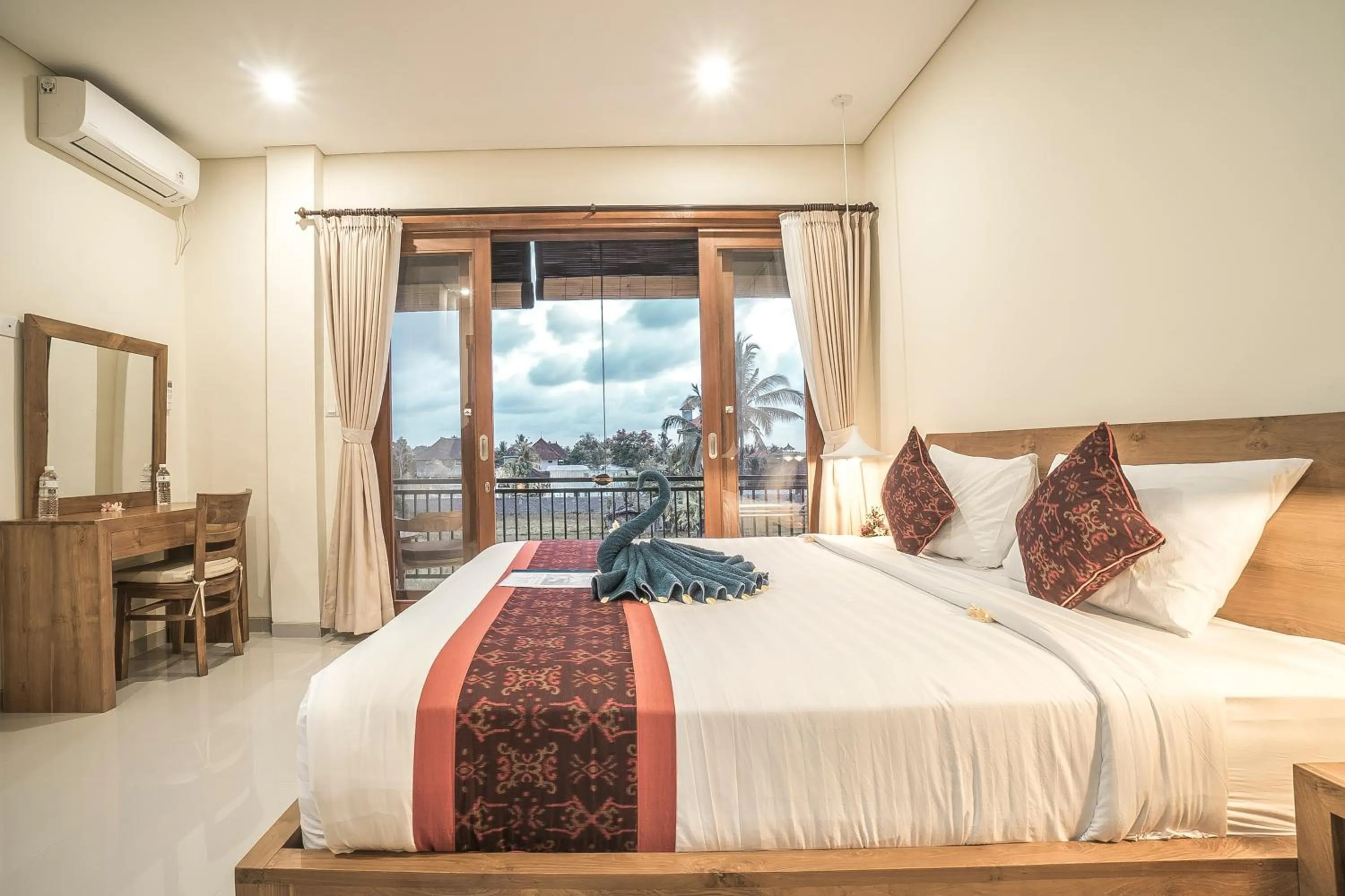 Bed in Three Dewi's Guest House