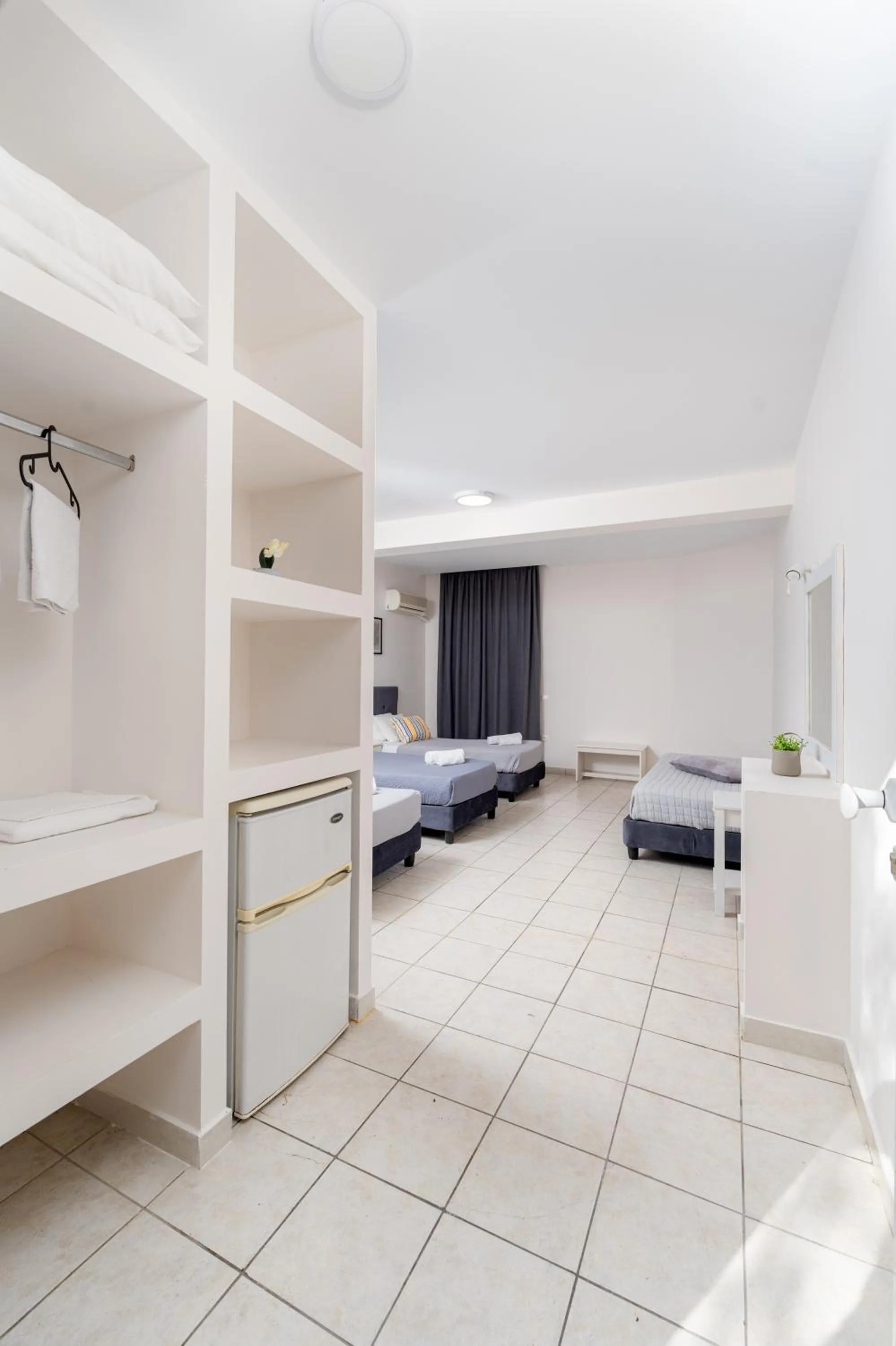 Bed in Blue Palm Hotel