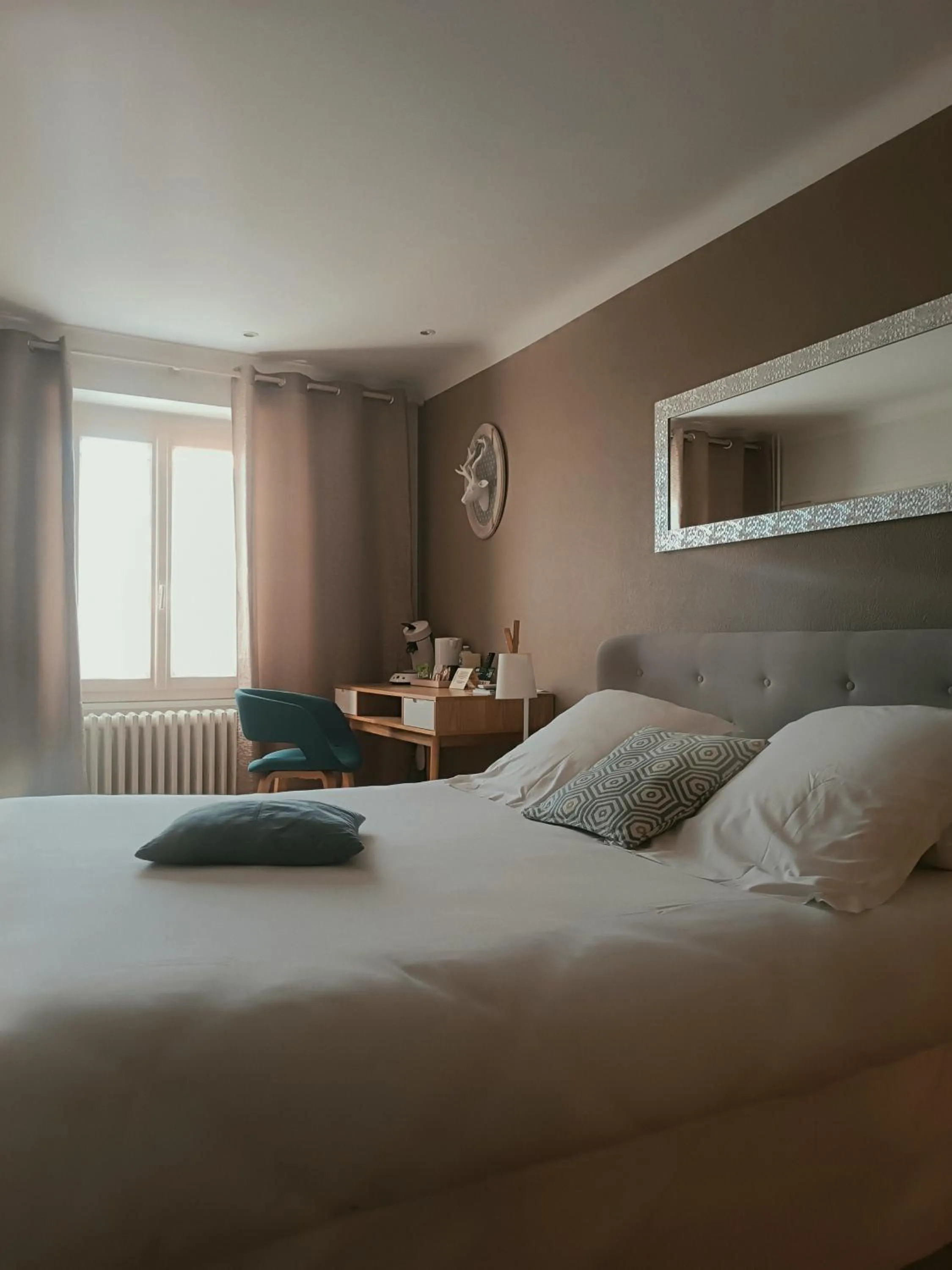 Bedroom, Bed in Logis Hôtel Le Central