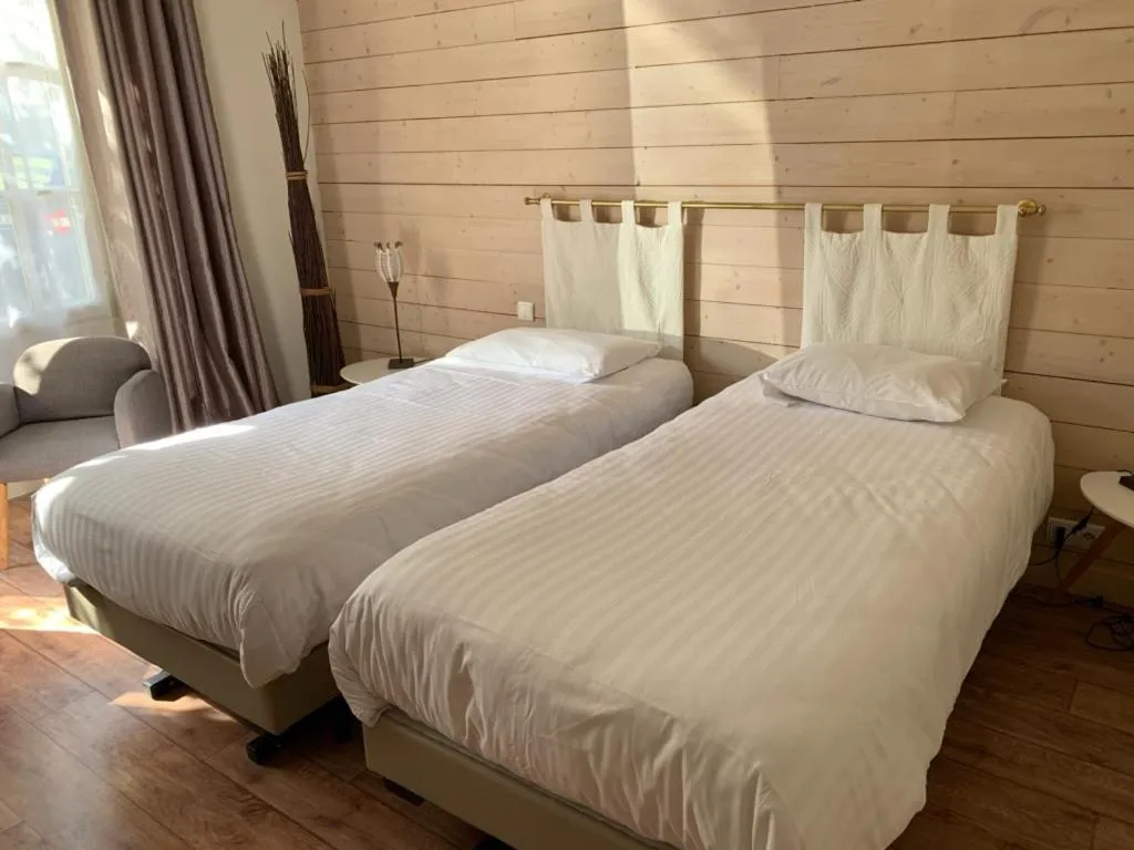 Bedroom, Bed in Logis Hôtel Le Central